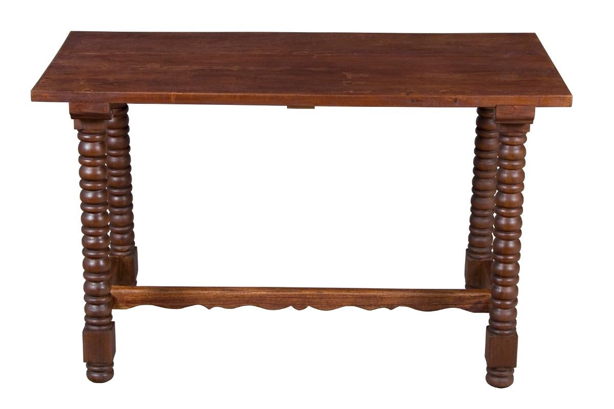 This beautiful sofa table is made from solid oak and has a gorgeous look that will pair well with all kinds of upholstery. The piece was originally made in France circa 1900 or so and has recently been rebuilt to ensure stability and tight joints.