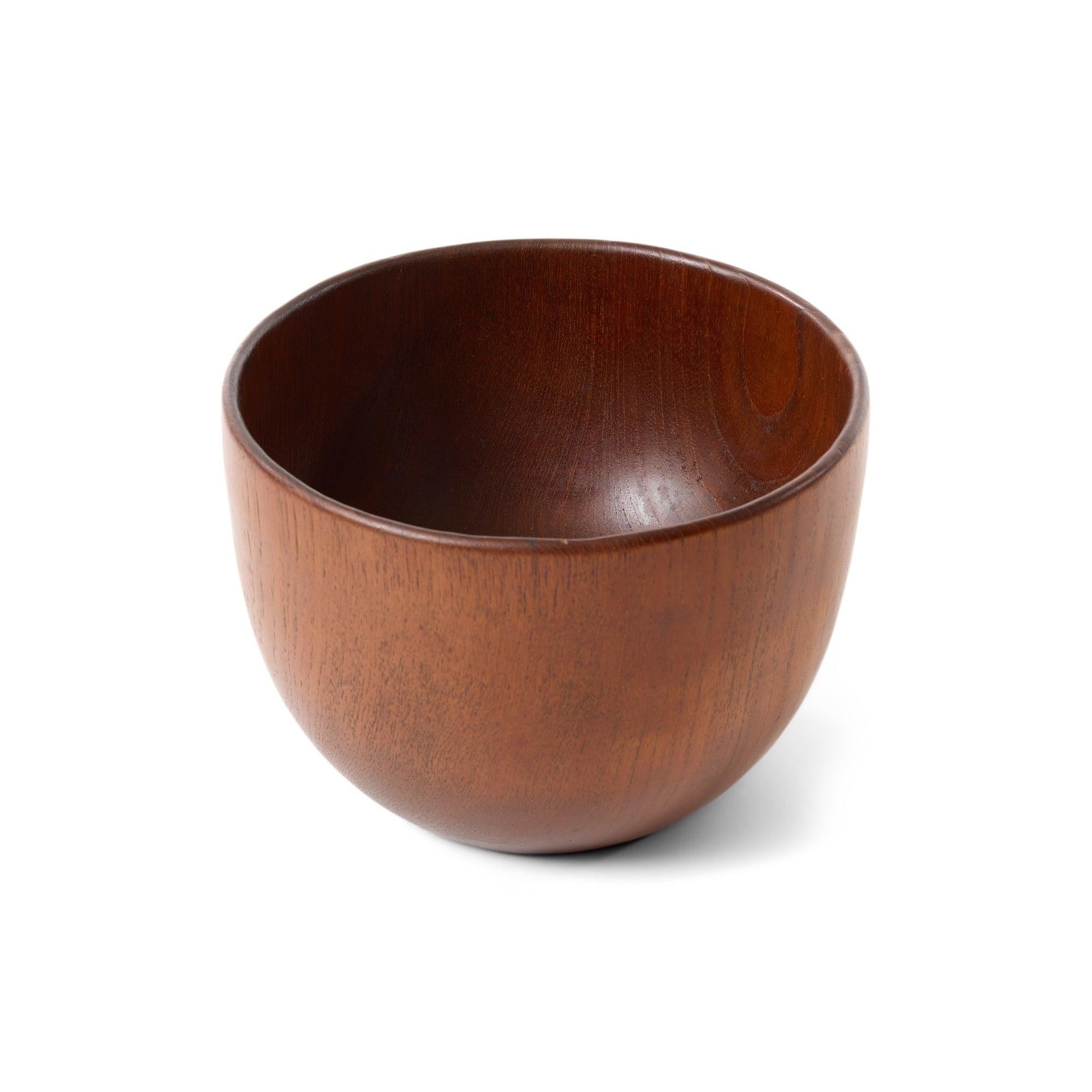 A finely proportioned and warmly hued turned solid teak bowl.
