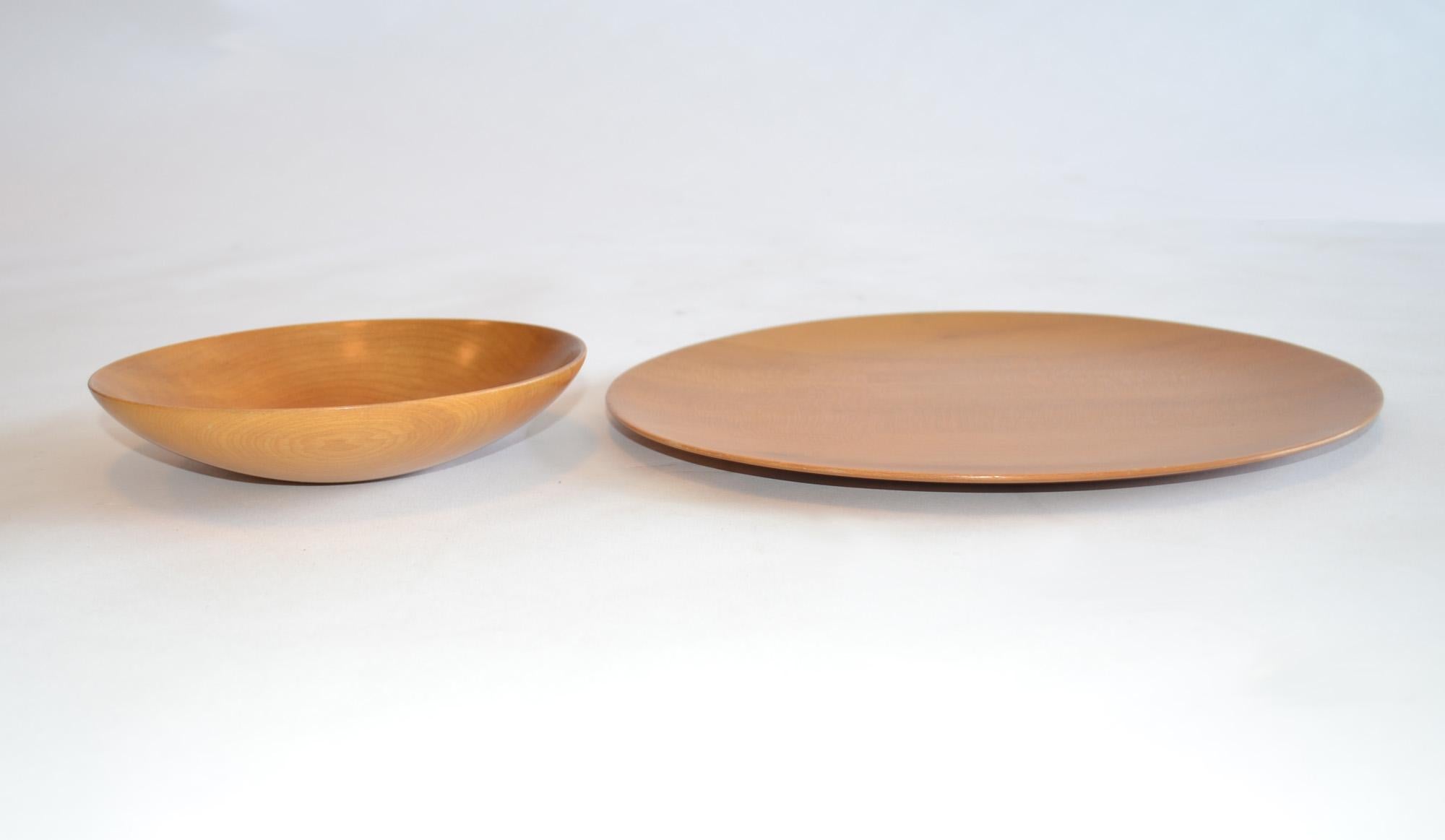 Turned wood bowl and platter by James Prestini, circa 1950s
Turned wood bowl and platter by James Prestini, circa 1950s. These pieces are exceptional examples of his work and are in excellent condition. A wonderful small low bowl in walnut and a