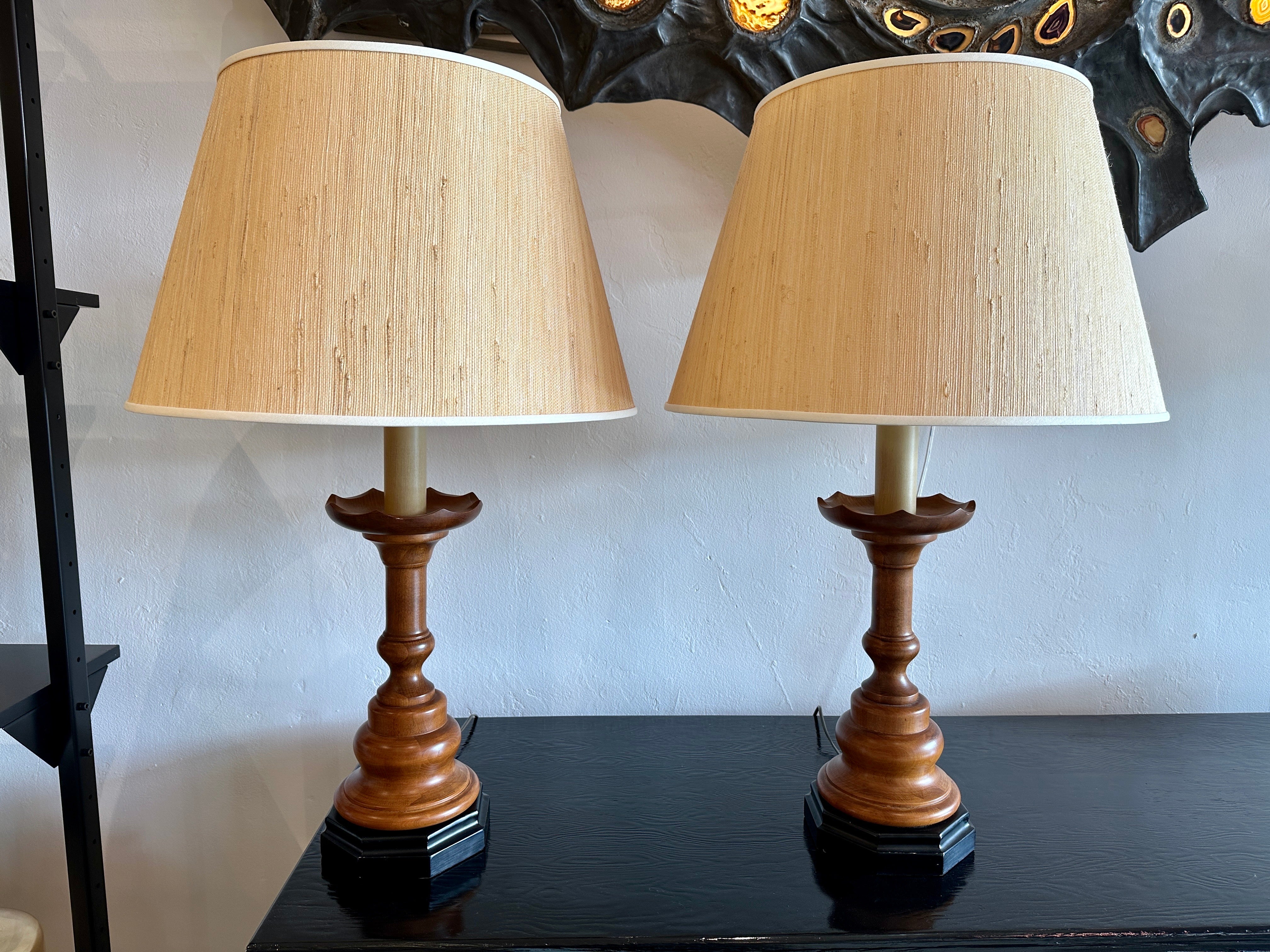 Beautiful rich walnut turned wood lamps with black lacquered base. Working and in original as-found condition.  THIS ITEM IS LOCATED AND WILL SHIP FROM OUR EAST HAMPTON, NY SHOWROOM.

NOTE: Shades shown are NOT included - for photography and scale