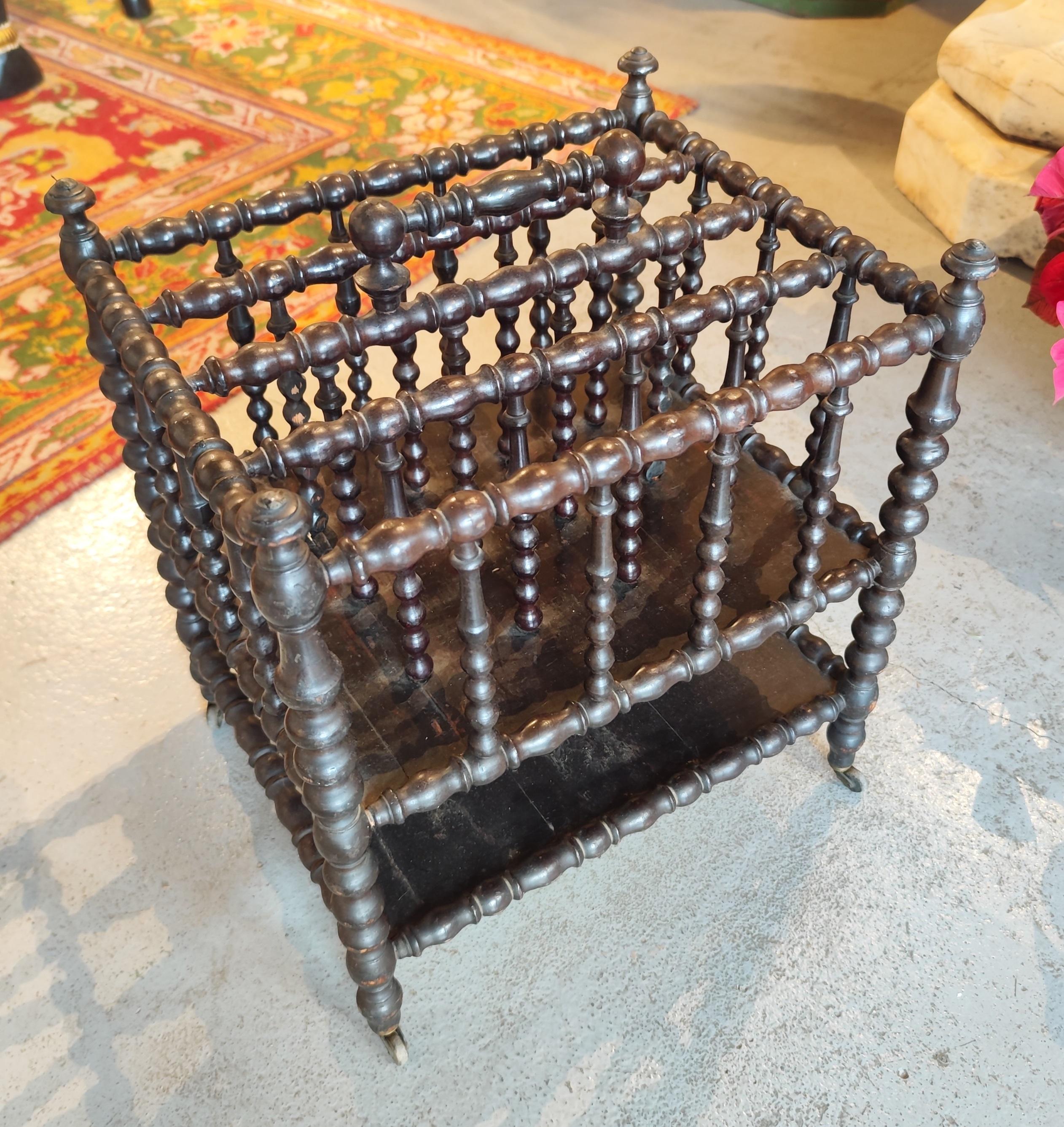 English Turned Wood Magazine Rack with Brass Wheels and Handle in the Centre For Sale