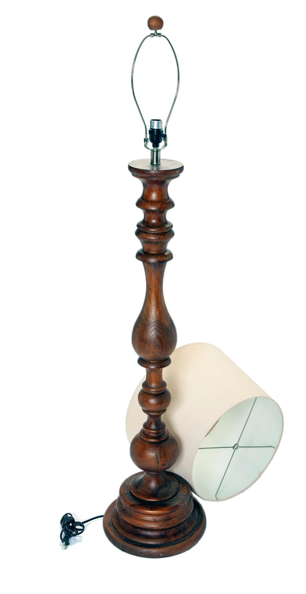 Turned hardwood floor lamp with linen barrel shade & wood finial. This traditional lamp is perfect for the study, any casual or coastal space.
A chic turned wood decorative floor lamp with original shade & finial 
The base of the floor lamp is 15
