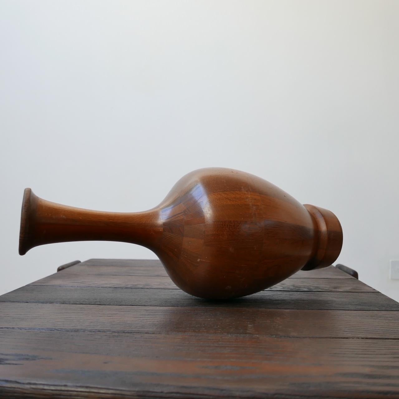 A turned wooden specimen vase by master craftsman Maurice Bonami (1929), Belgium.

Intricately constructed from many different specimens of wood and turned on a lathe. 

Produced between 1965 and 1975.

Commonly misattributed to De