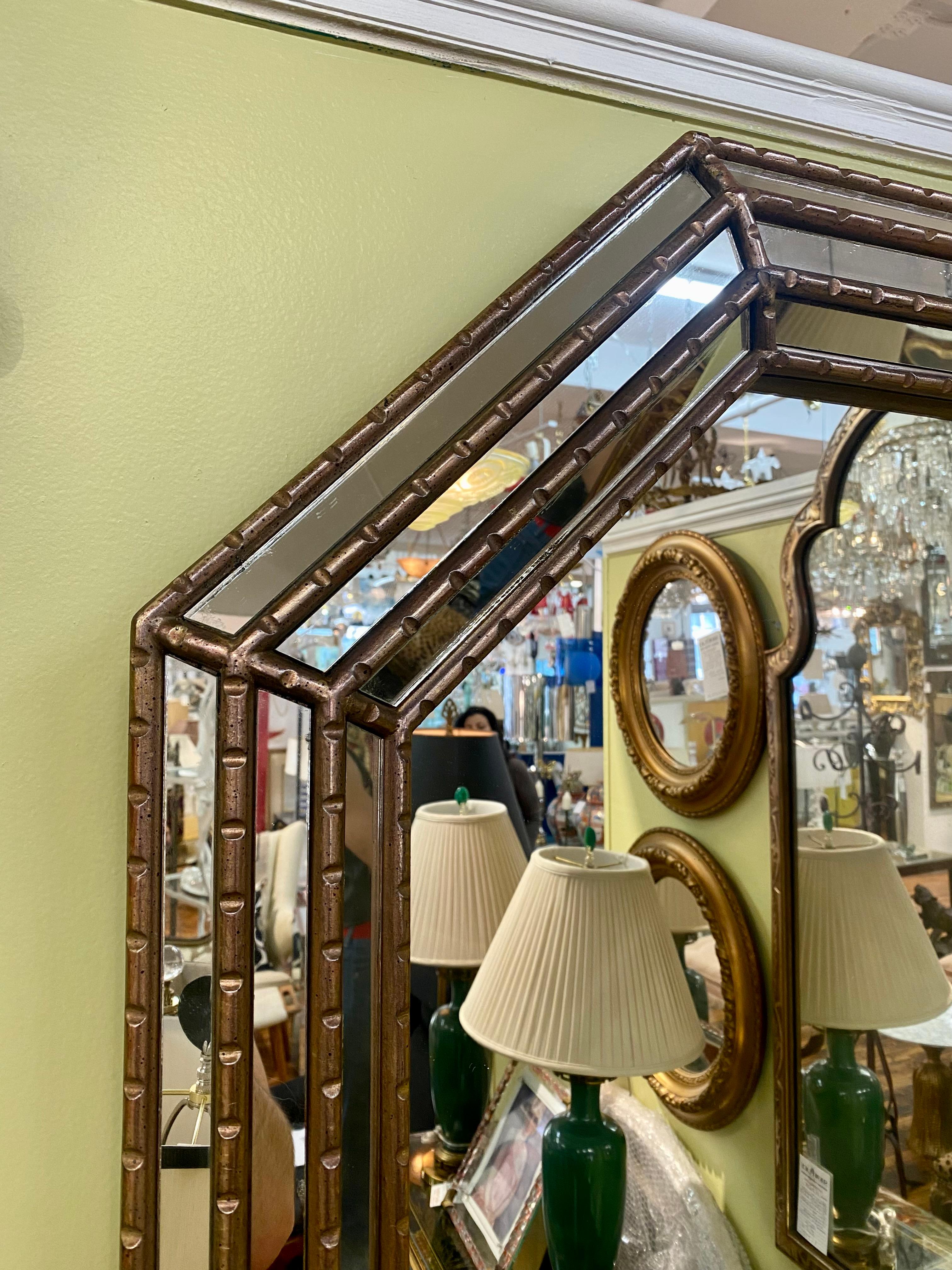 1950s Turner Accessories Hollywood Regency style mirror. Gilded wood on the frame. This mirror can be hung vertically or horizontally.


