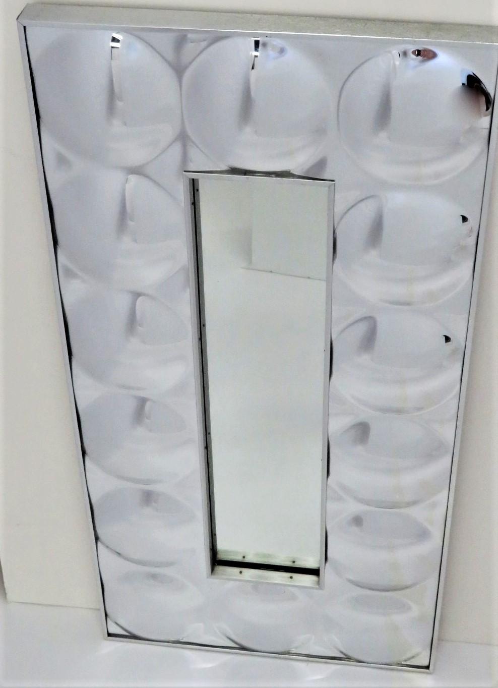 Fabulous Space Age Modern Mirror with 14 convex circular bubble acrylic mirrors surrounding a rectangular mirror in the center. Made by Turner, label on the back.  In very good condition, no issues. Just wonderful !

Measurements: 36 inches