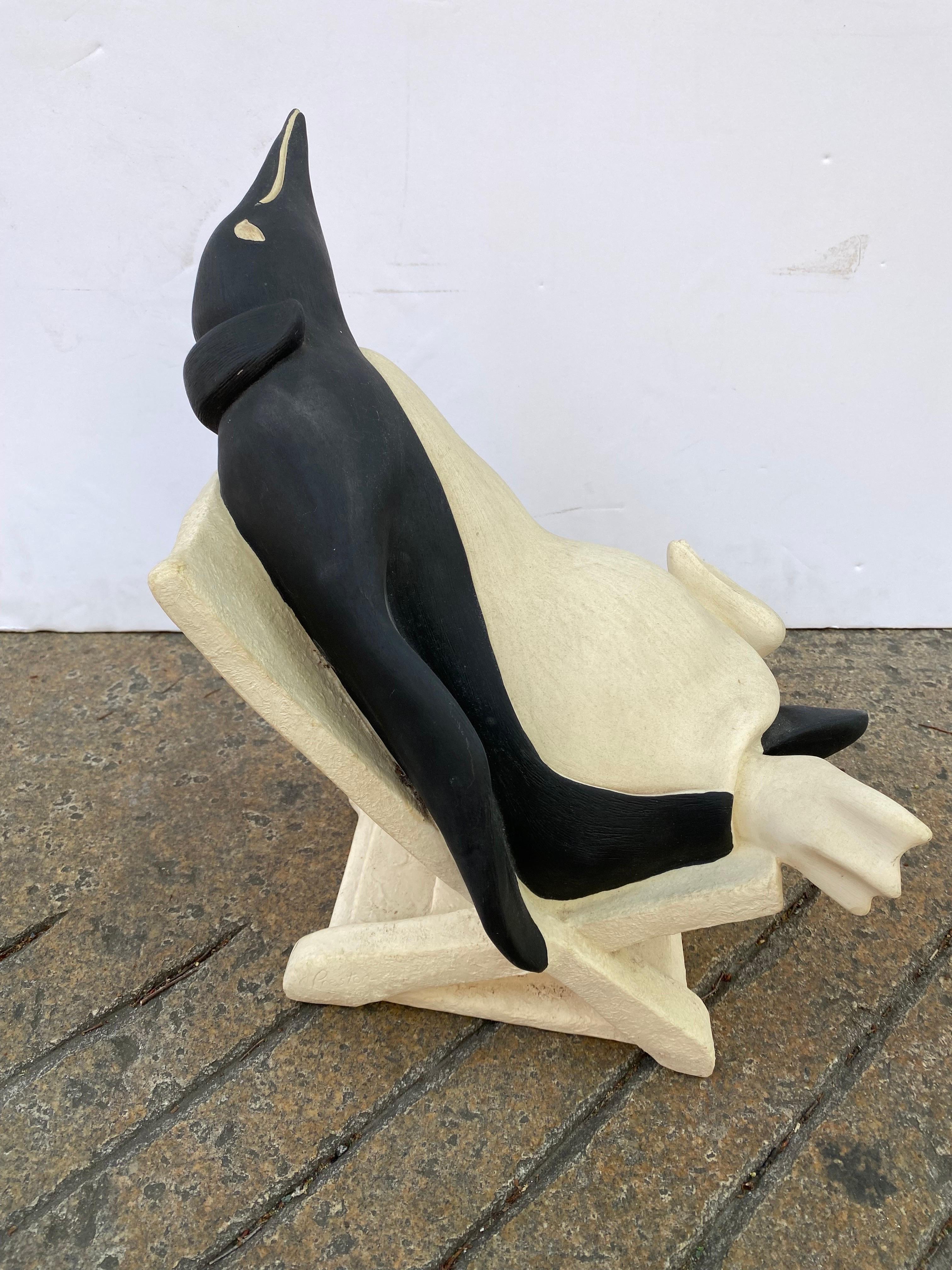 Reclining Penguin sitting on a deck chair. Signed Turner Sculpture 1991. In nice shape! Fun Whimsical Design!