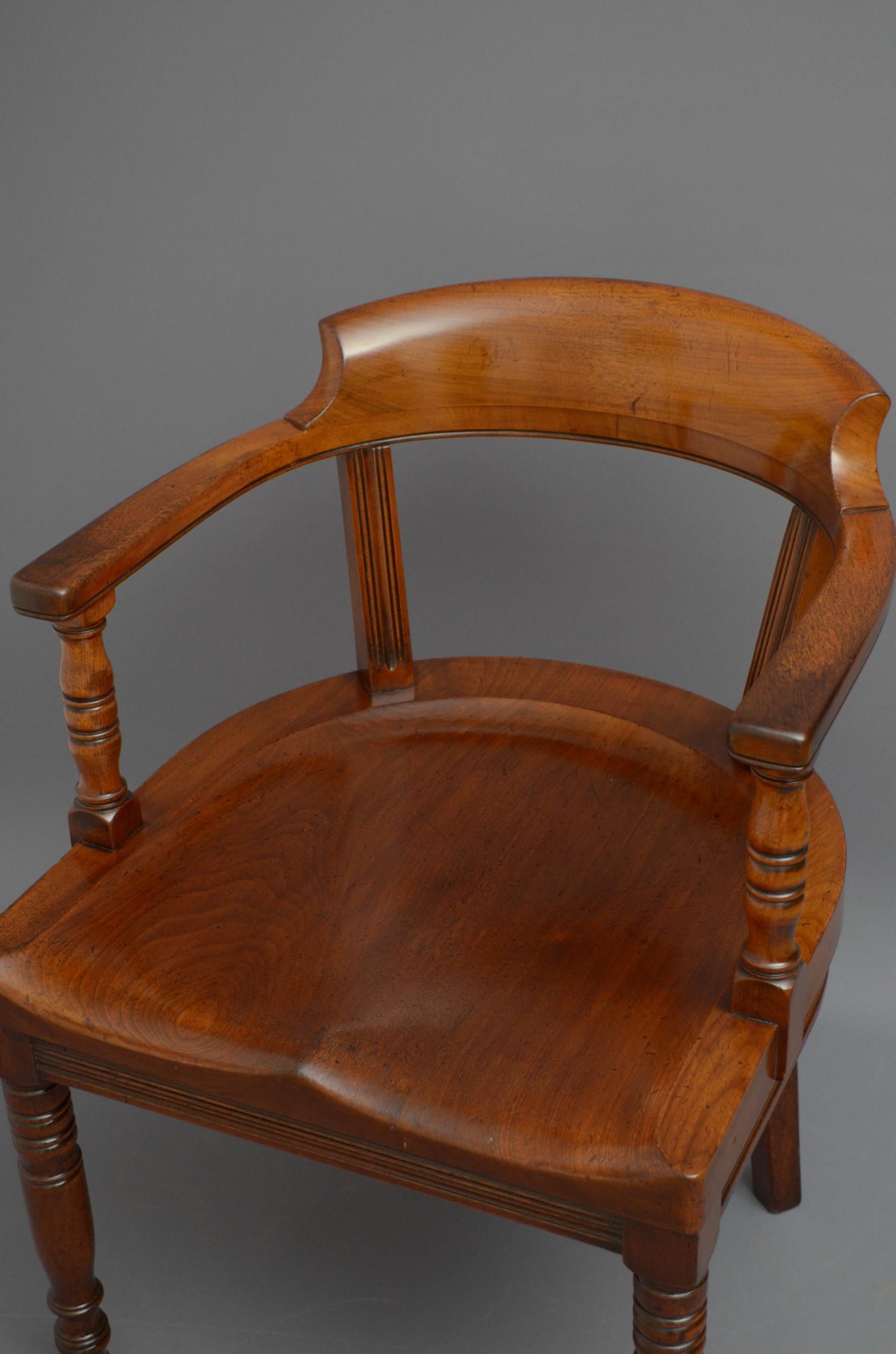 Sn5055, substantial late Victorian walnut office chair, having shaped top rail with reeded supports, open arms and generous seat with reeded front and side rail, standing on turned and ringed legs terminating in original brass castors. Stamped