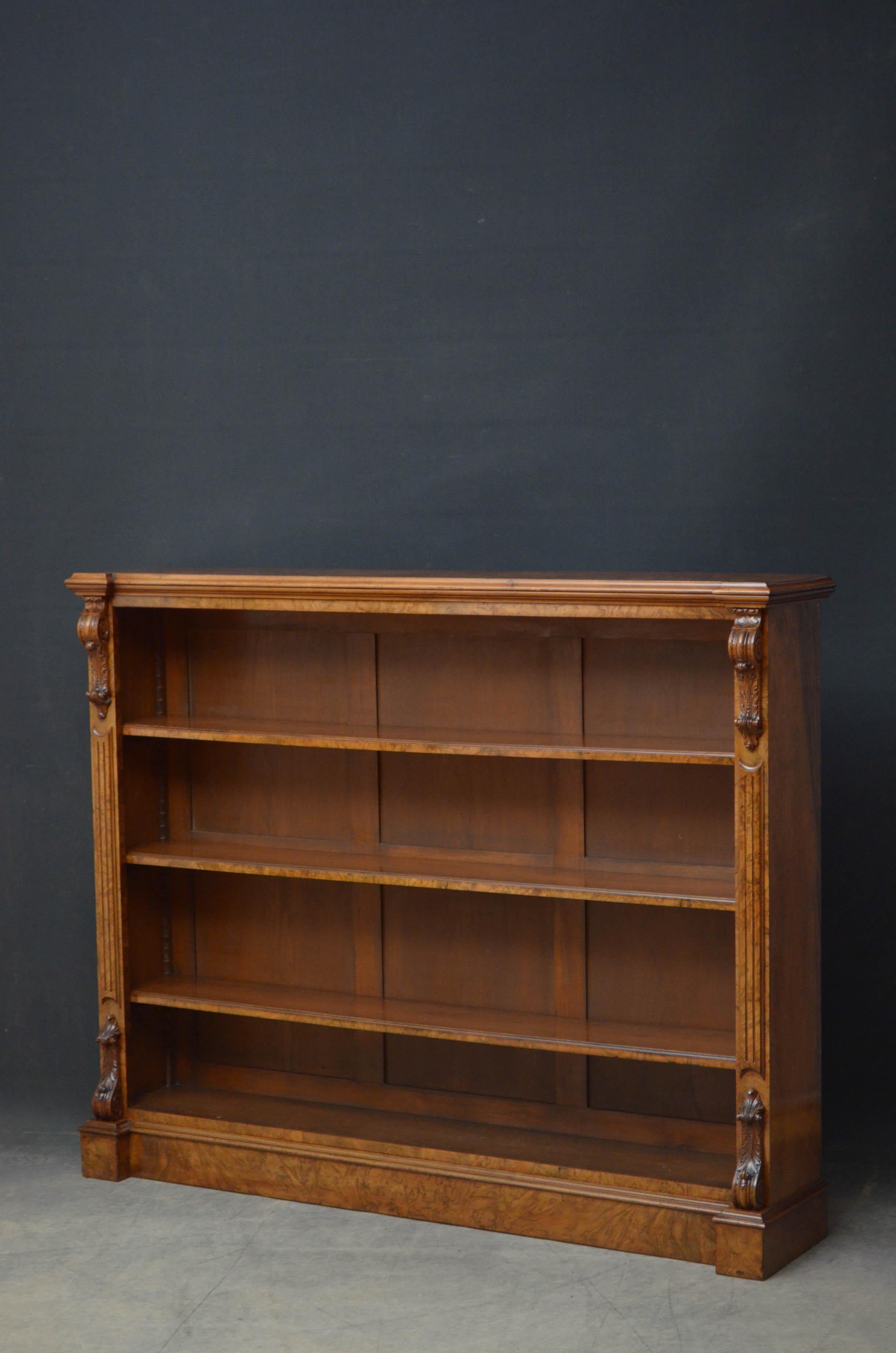 Sn5212 Superb quality Turner, Son & Walker open bookcase in walnut, having burr walnut top above three height adjustable shelves flanked by reeded pilasters with finest quality drop carvings to the top and base, all standing on moulded plinth. This