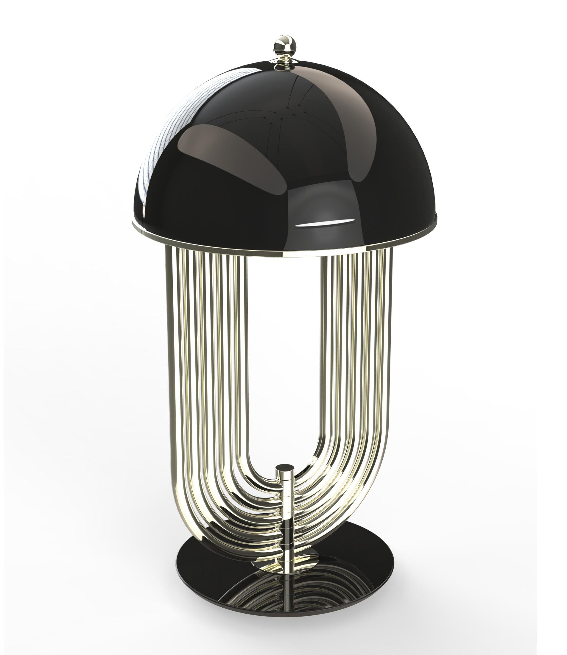 Turner Art Deco table lamp was inspired by the electrifying and memorable dance moves of the iconic pop singer. Tuner is a large table lamp handmade in brass and aluminum. The body has a gold plated finish, while the shade was lacquered a black