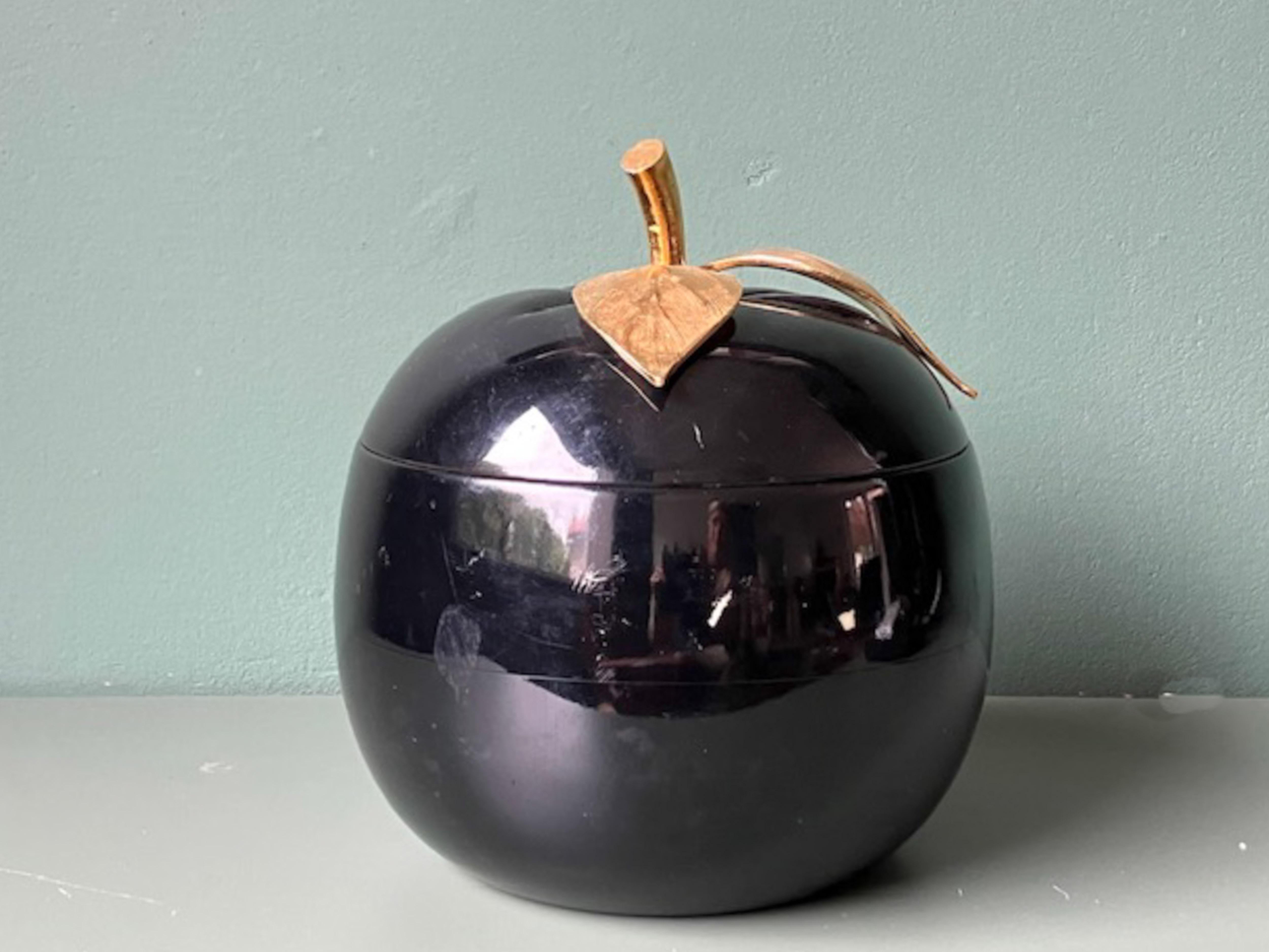 Big black ice bucket in the shape of an apple with gold leaf and branch handle, designed by Freddo Therm, Switzerland. In vintage condition with signs of wear as depicted on the photographs. 

Dimensions: 22cm h, 20cm w/d
