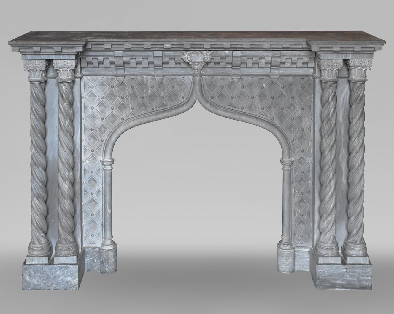 Turquin marble fireplace in neo-Gothic styleThis Turquin Blue marble fireplace in neo-Gothic style was executed in the first half of the 19th century, probably around 1840. The lintel is structured by several successive lines of modillions. In the