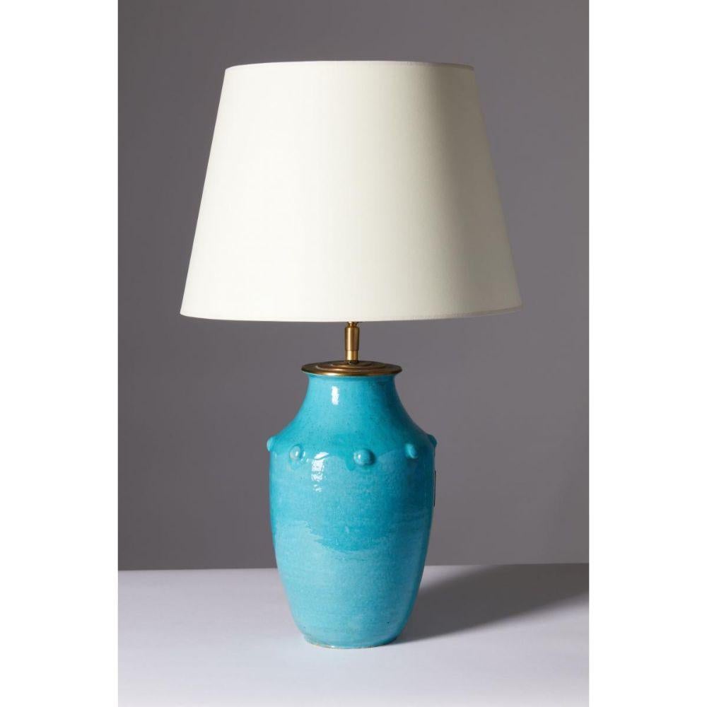 Turquiose Glazed Ceramic Table Lamp by Primavera for Le Printeps, France

Small but striking glazed ceramic table lamp in a vibrant turquoise glaze. Created by the French studio Primavera. for the esteemed turned of the century department store Le