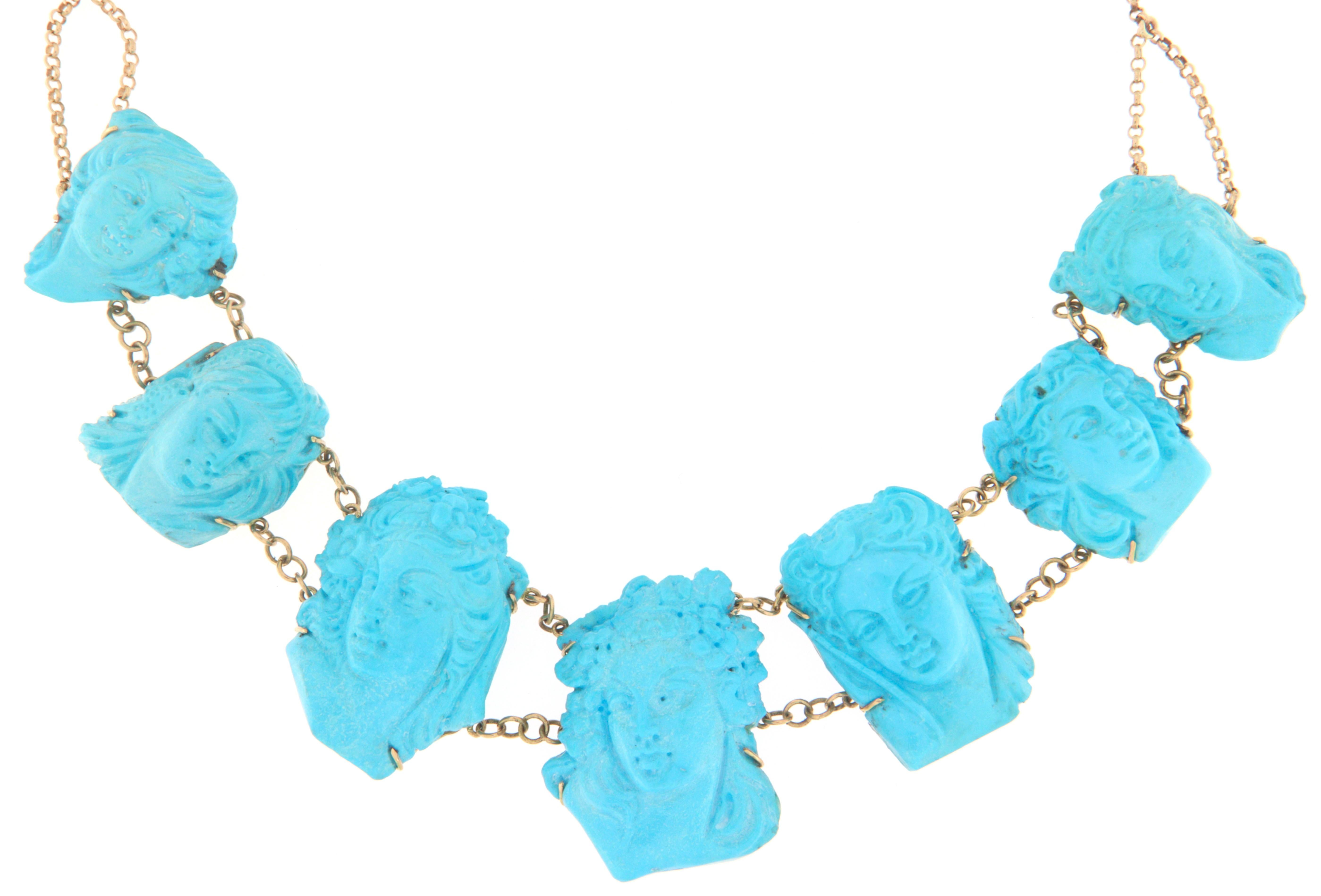 Stunning 14-karat gold necklace, an exclusive piece of timeless charm that combines the elegance of precious materials with the richness of artisanal craftsmanship. This masterpiece stands out for its seven hand-carved cameos in natural turquoise,