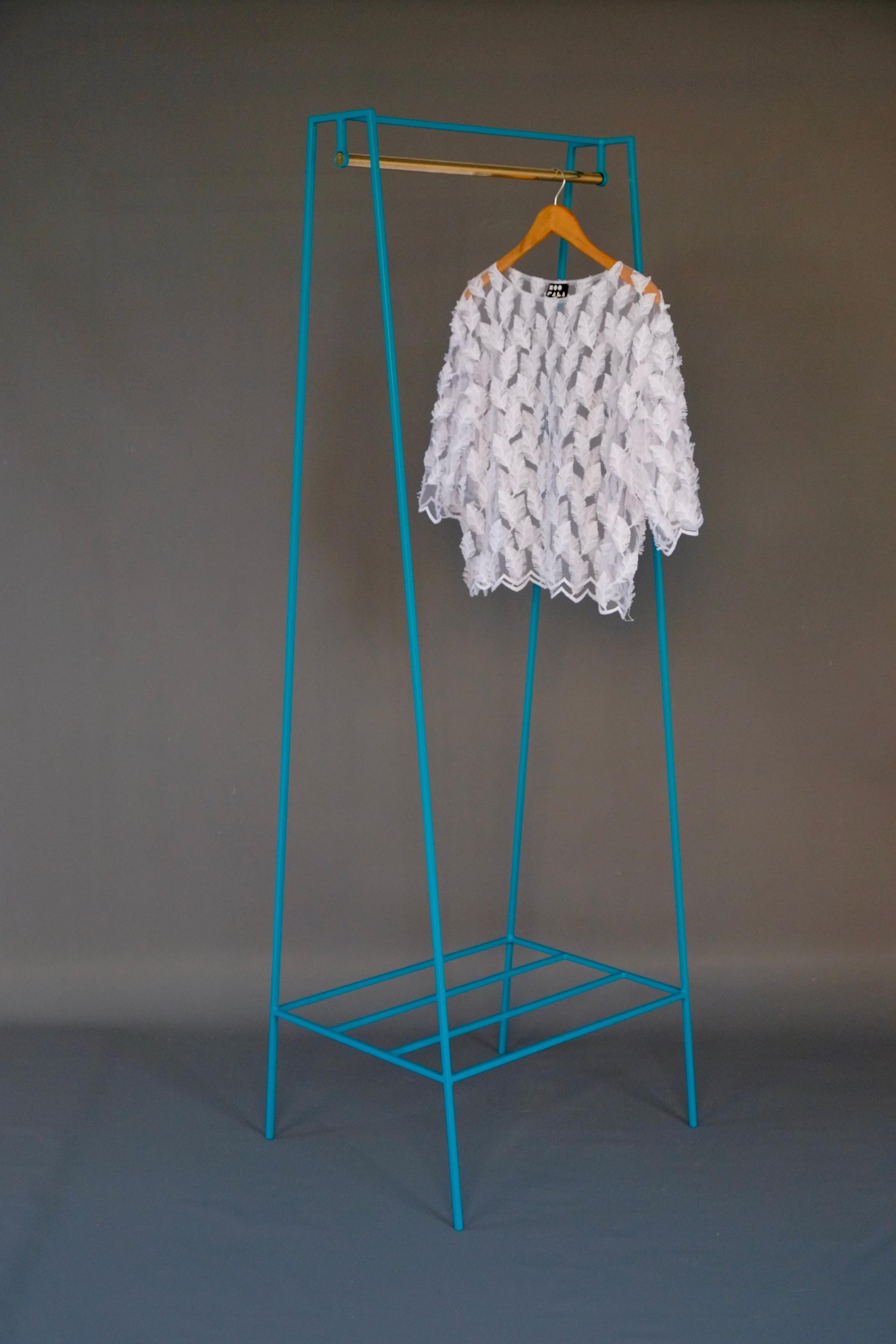 The steel slimline 'A' clothes rail is one of &New's signature pieces. A stunning addition to any bedroom or hallway, the minimal design looks delicate but is surprisingly robust. This one is powder coated in turquoise, but the clothes rail is