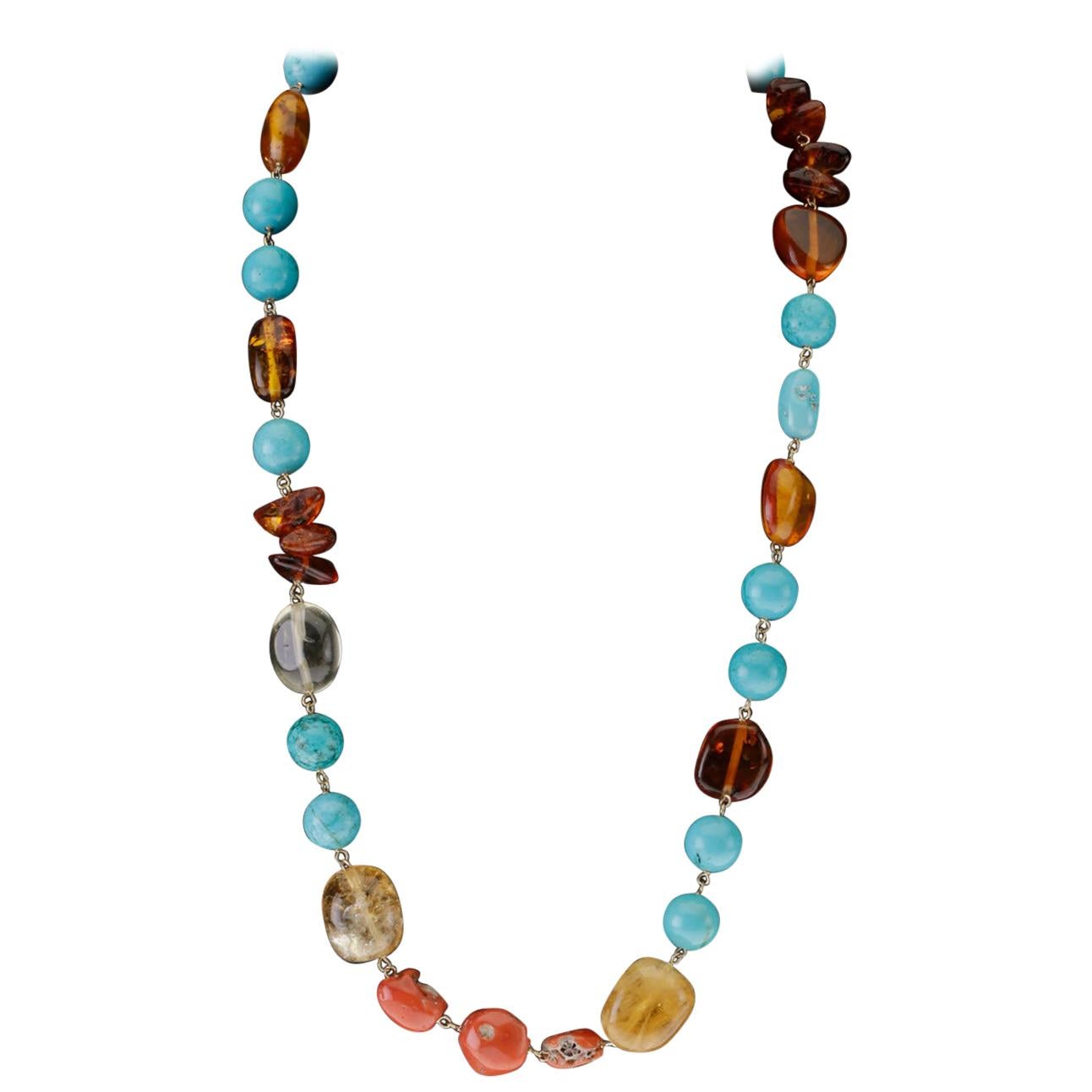 Long collier en vermeille avec turquoise, ambre, citrine et corail