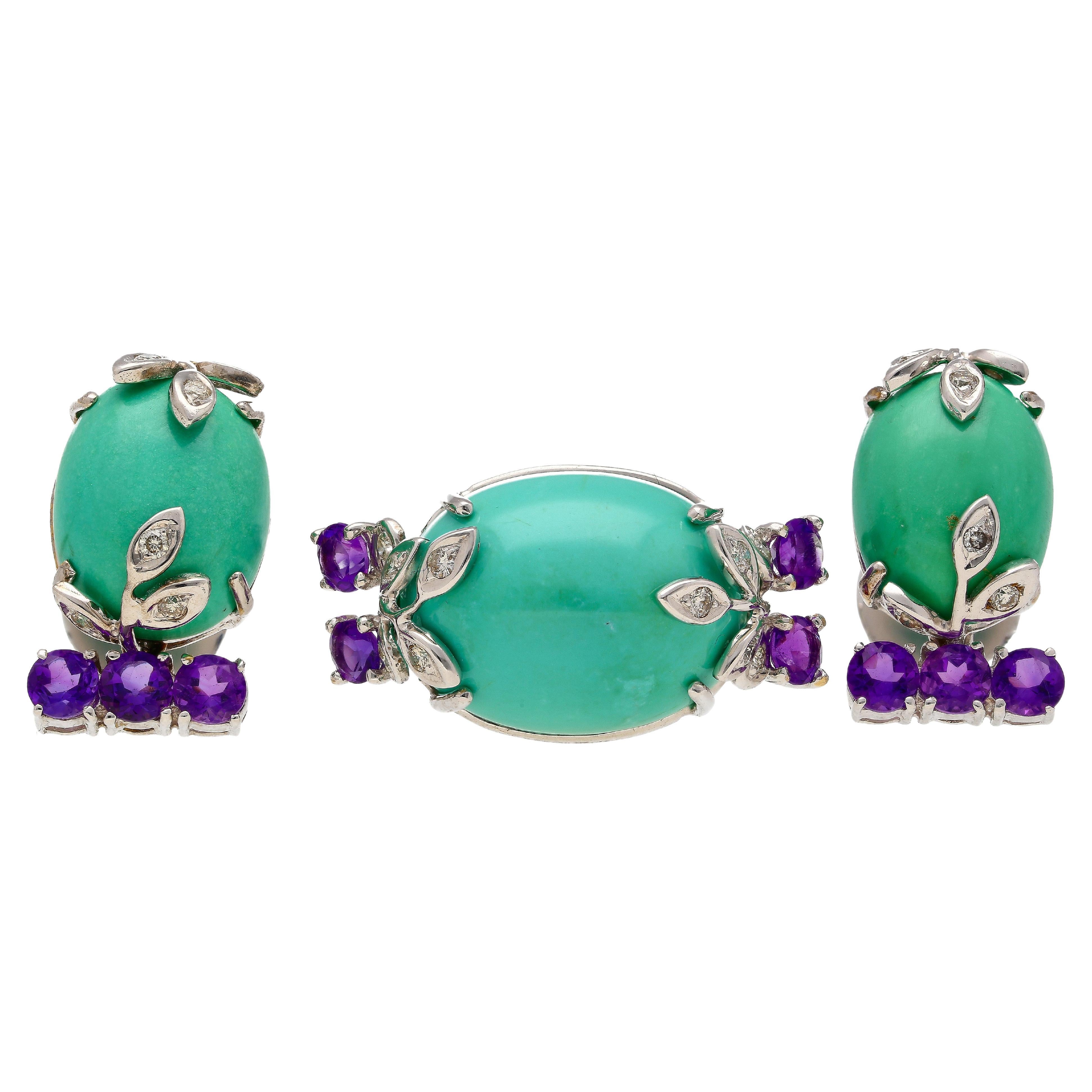 This Jewelry set is crafted from 18K White Gold. Each piece consists of amethyst, turquoise and diamonds. This set shares a floral theme and design.
The ring weighs 5.38 grams, and the prong setting secures the unique center stone turquoise,