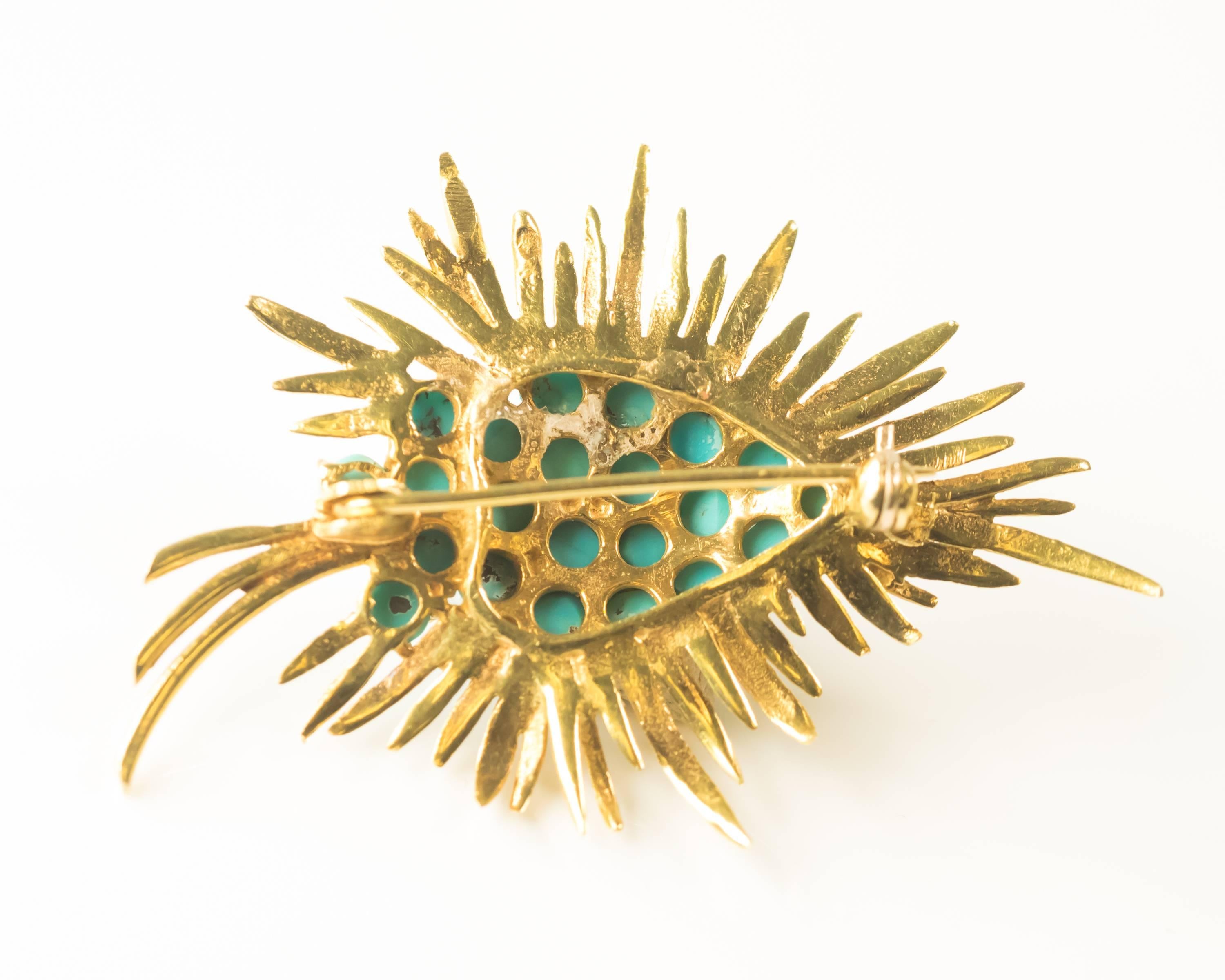 1980s Abstract Leaf Brooch - 18 Karat Yellow Gold, Turquoise

Features a cluster of prong set Turquoise spheres surrounded by 18 Karat Gold Rays. The Gold rays extend from the center of the brooch outward in all directions. Three slightly longer