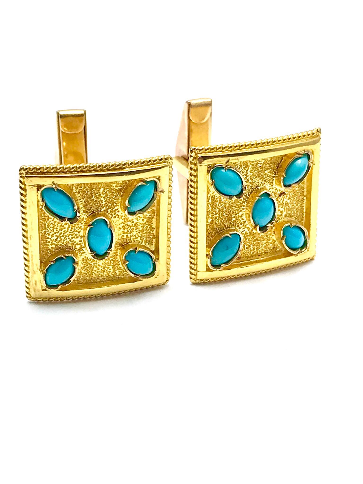 A great pair of Turquoise and 18 karat yellow gold cufflinks!  Each cufflink has five prong set cabochon turquoise sitting atop a bright textured gold and high polish frame on a simple toggle back, for ease of use.  The cufflinks measure 18.00 x