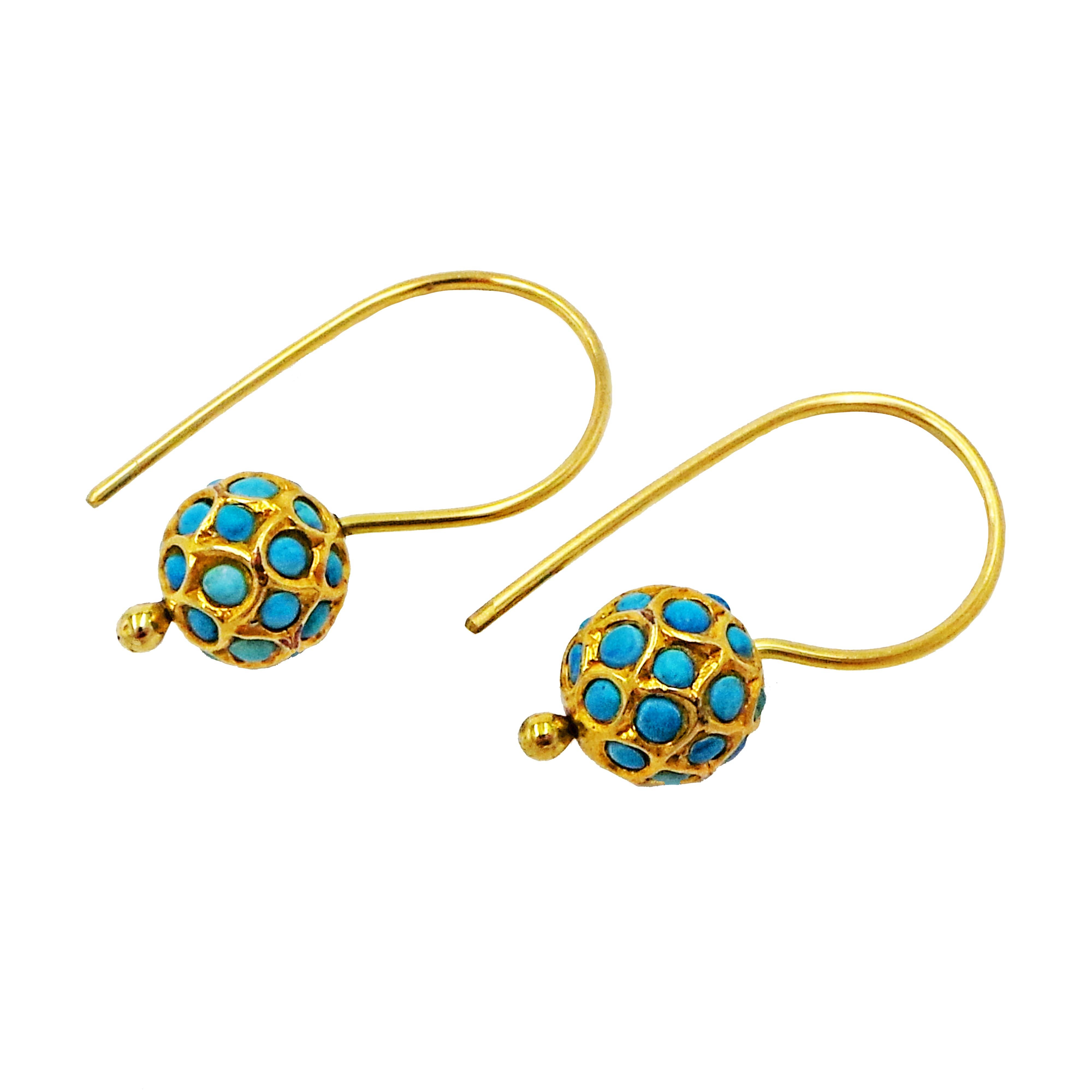 Turquoise cabochons and 18k yellow gold ball on 18k gold French wire drop earrings. 1.13 inches or 28 mm in length. Simple, contemporary earrings with rich color and interesting pattern.