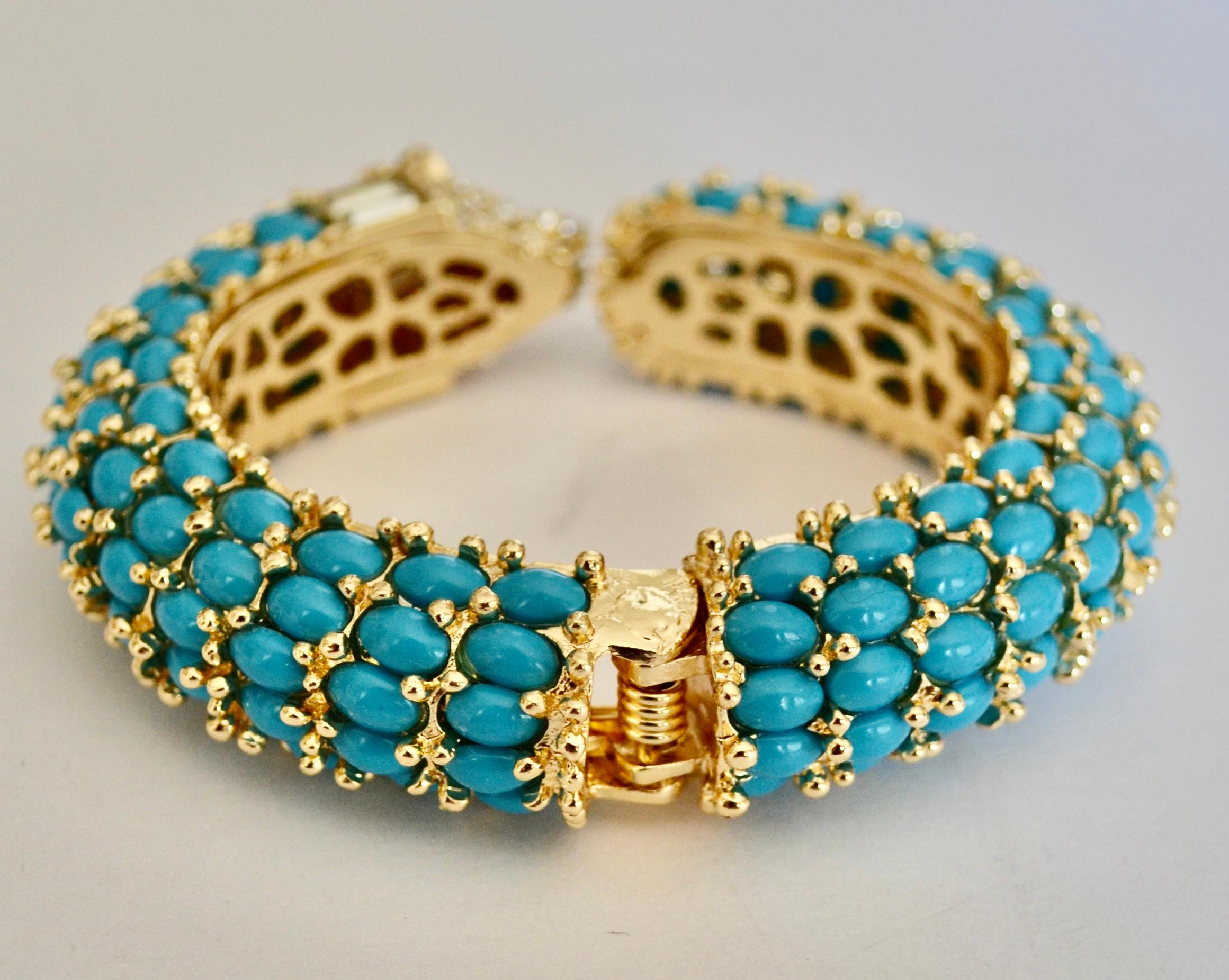 Statement bracelet in turquoise resin and zircon . Hinged bracelet.
French designer.