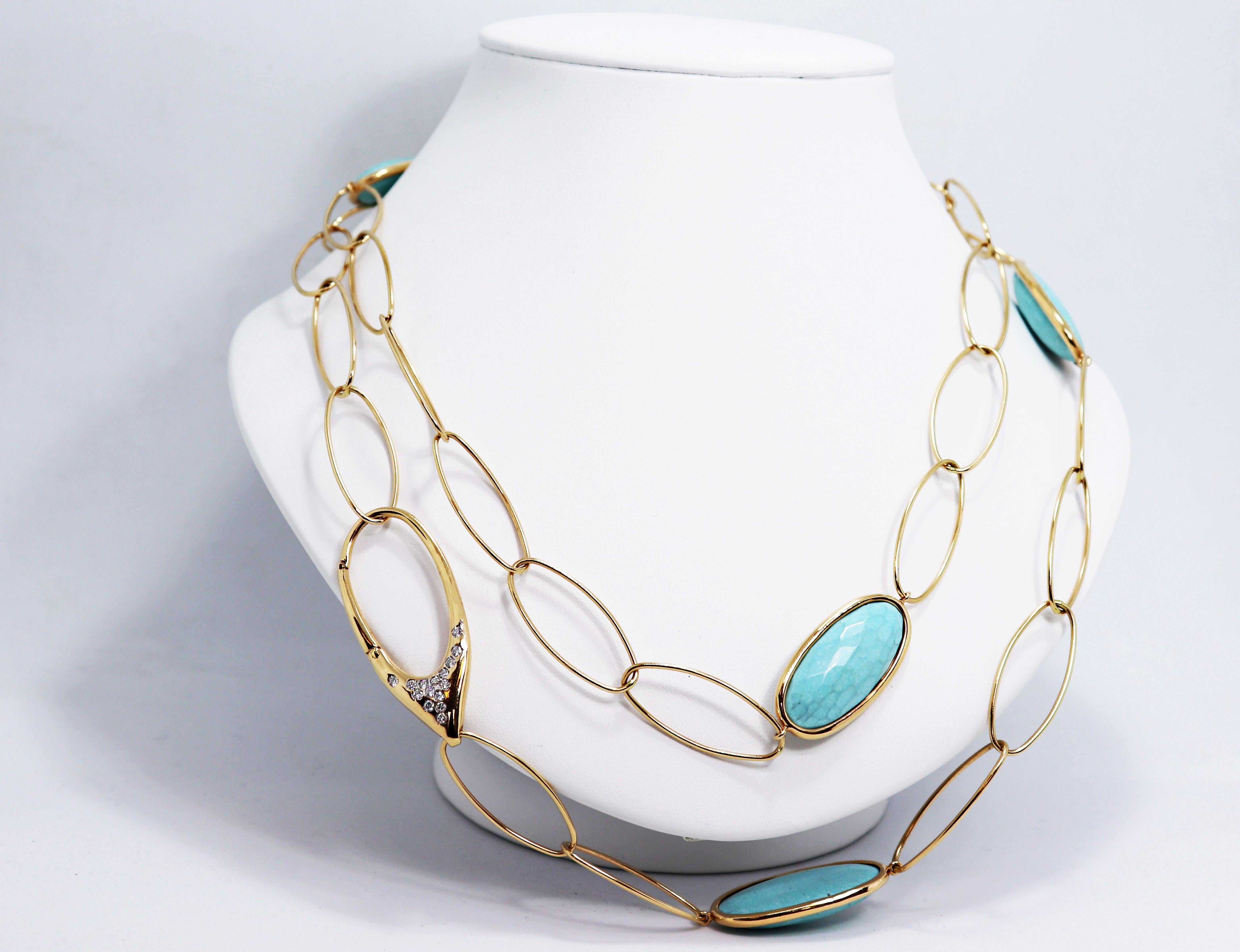 Beautiful fancy link chain set with four oval shaped  cabouchon turquoise stones, rub-over set in 18ct yellow gold. The chain is beautifully finished with an 18ct gold hinged clasp set with 30 round brilliant cut diamonds. The chain measures 40