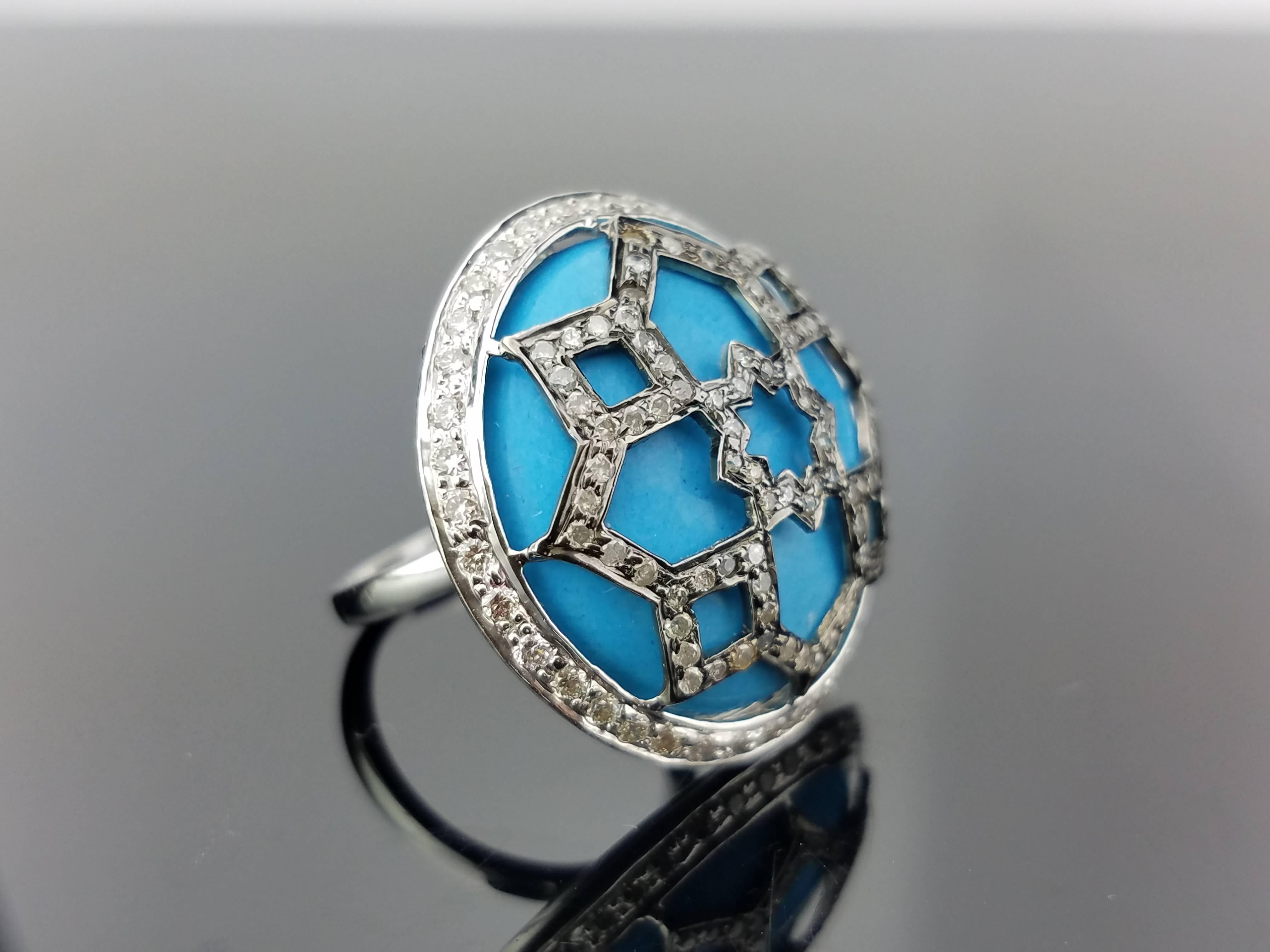 A statement, art-deco looking turquoise and diamond cocktail ring, all set in 18K Gold. 

Stone Weight:
22.75 carat Turquoise
1.09 carat Diamond

18K Gold weight: 6.96 grams

The ring can be resized without additional cost. 
