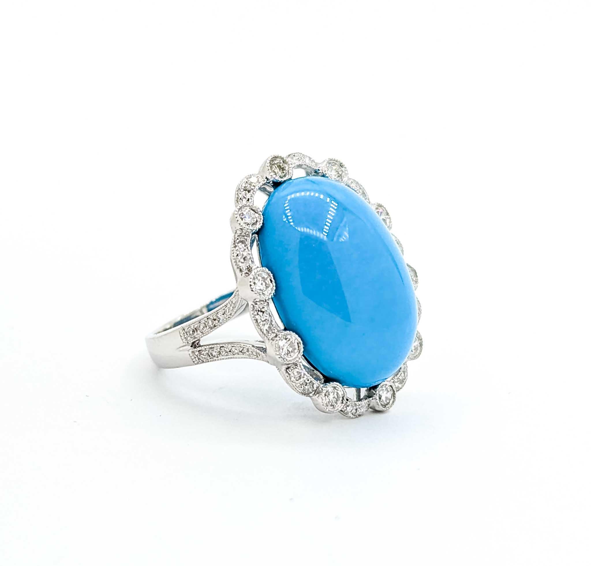 Turquoise and Diamond 18k White Gold Ring

Introducing this enchanting turquoise ring, meticulously crafted in lustrous 18k white gold. The ring is a stunning display of elegance, featuring a captivating 10.5 carat turquoise gemstone set in a