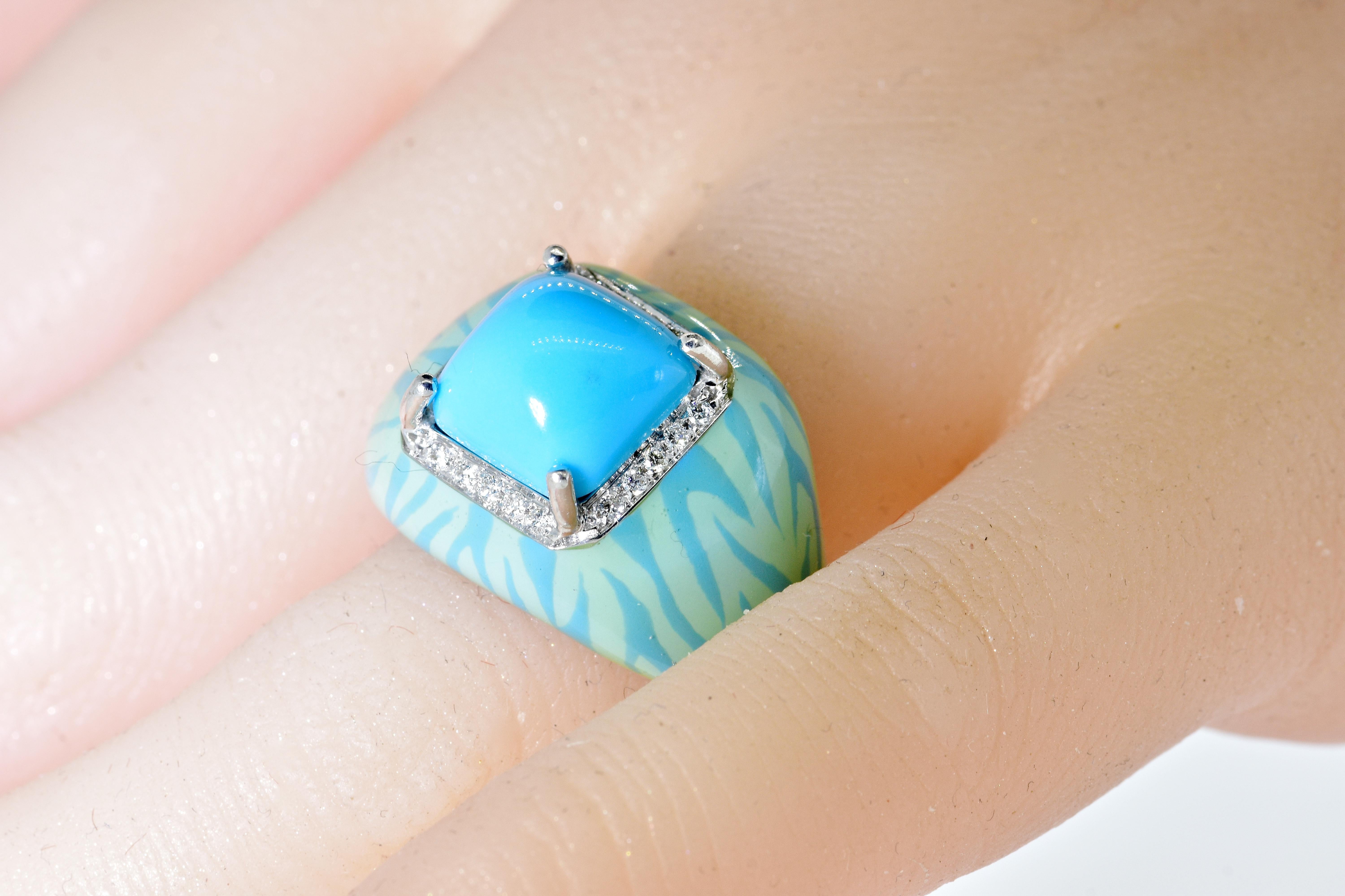 Diamond and Turquoise - a fine pleasing bright robin's egg blue color.  This prong set center stone is a high sugar-loaf cabochon.  20 fine white brilliant cut diamonds, all well cut and well matched, near colorless (G) and very very slightly
