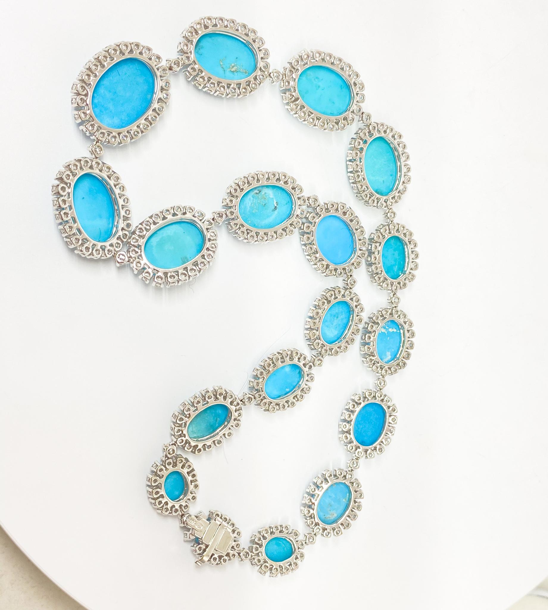 Spectacular beaded necklace in 18KT white gold featuring oval cut prong set vibrant turquoise stones weighing approximately 117.60 carats total each surrounded by a beautiful halo of prong set round cut white diamonds to accentuate the sky blue