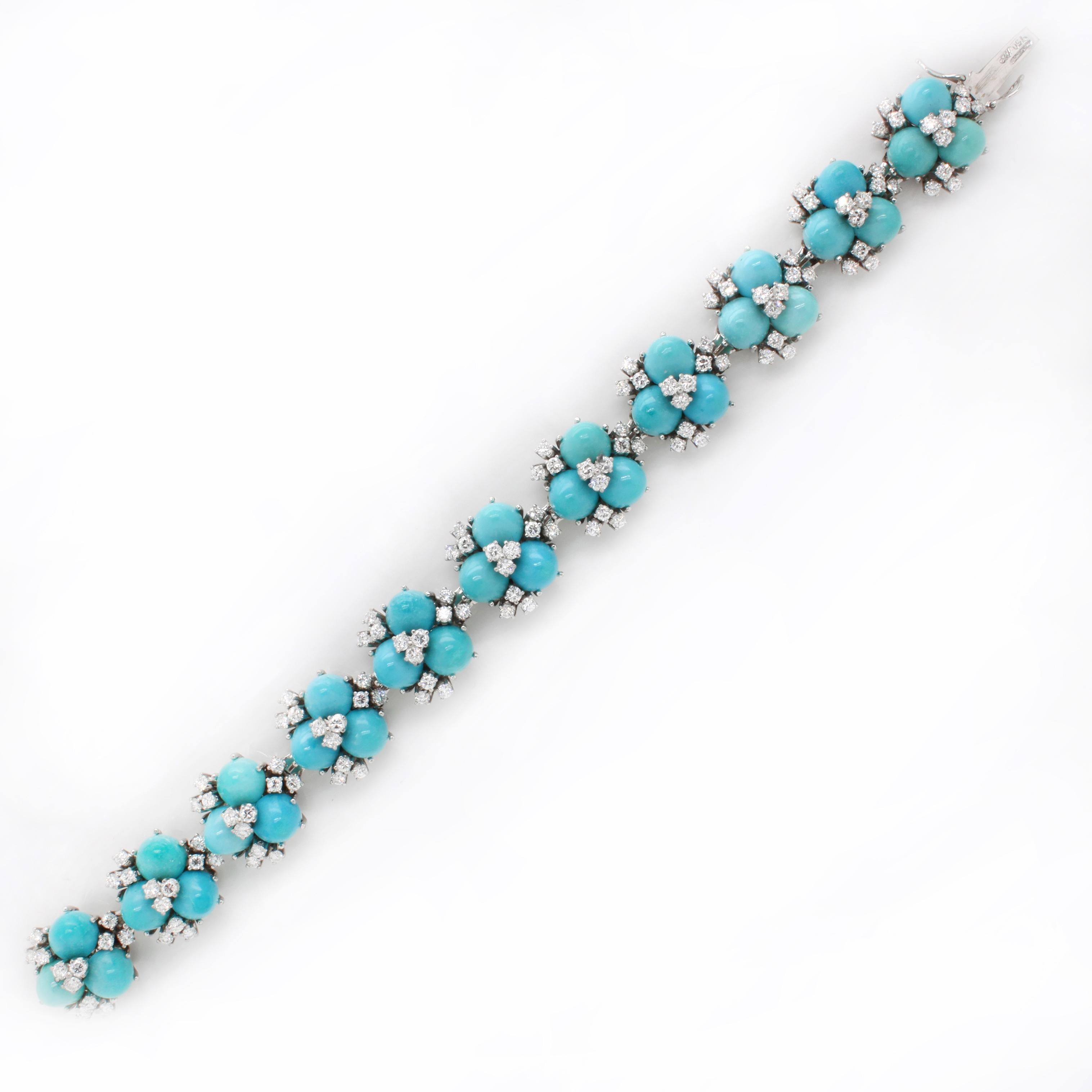 A beautiful turquoise and diamond bracelet made of 11 panels, each set with three turquoise sugarloafs and smaller round brilliant cut diamonds, in 18k white gold. The turquoises are nicely matched and they have a very refreshing and joyful colour.