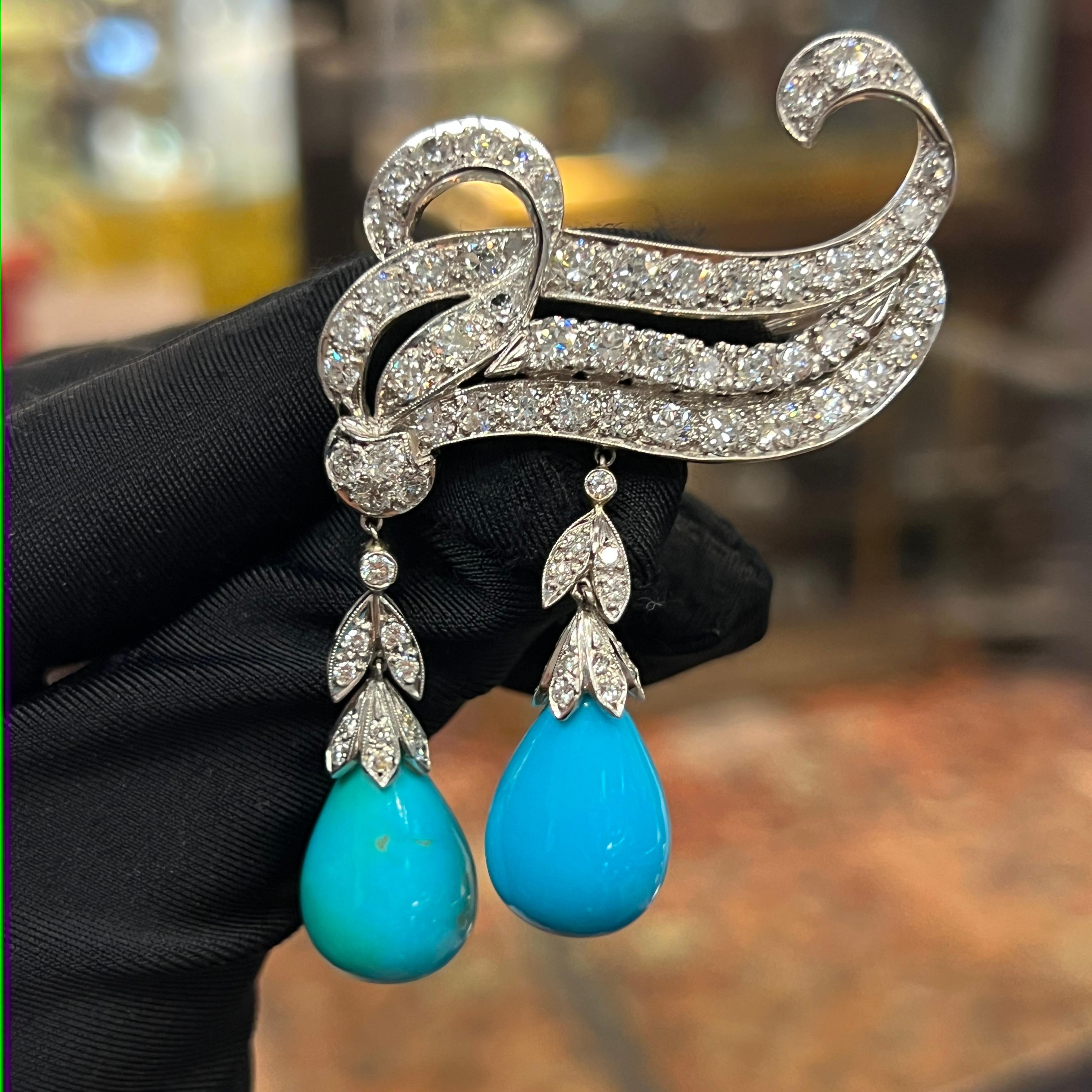 Turquoise and Diamond Brooch

A white gold brooch set with 83 round cut diamonds and 2 pear-shaped turquoise drops

Approximate Diamond Weight: 5.82
Approximate Length:  1.5 inches
Metal Type: 14-karat gold