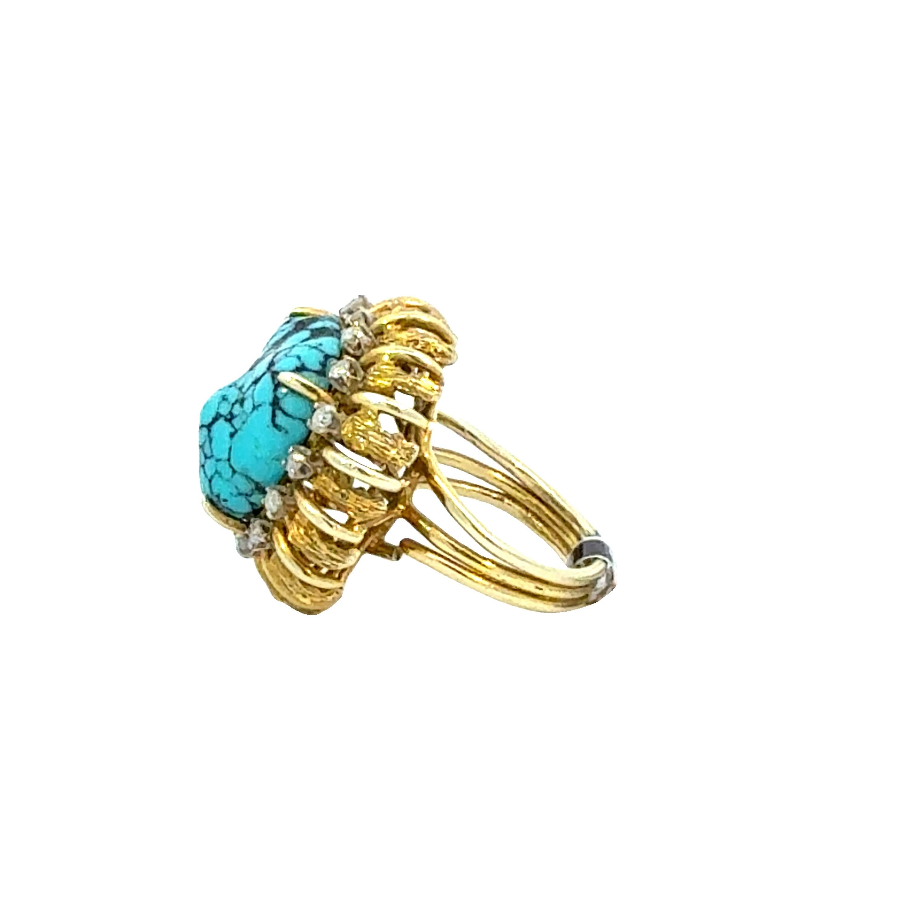 This 14K gold turquoise and diamond cocktail ring is a striking retro statement piece featuring a bold, natural turquoise cabochon with dramatic black veining, surrounded by a radiant halo of round brilliant-cut diamonds and intricate textured gold