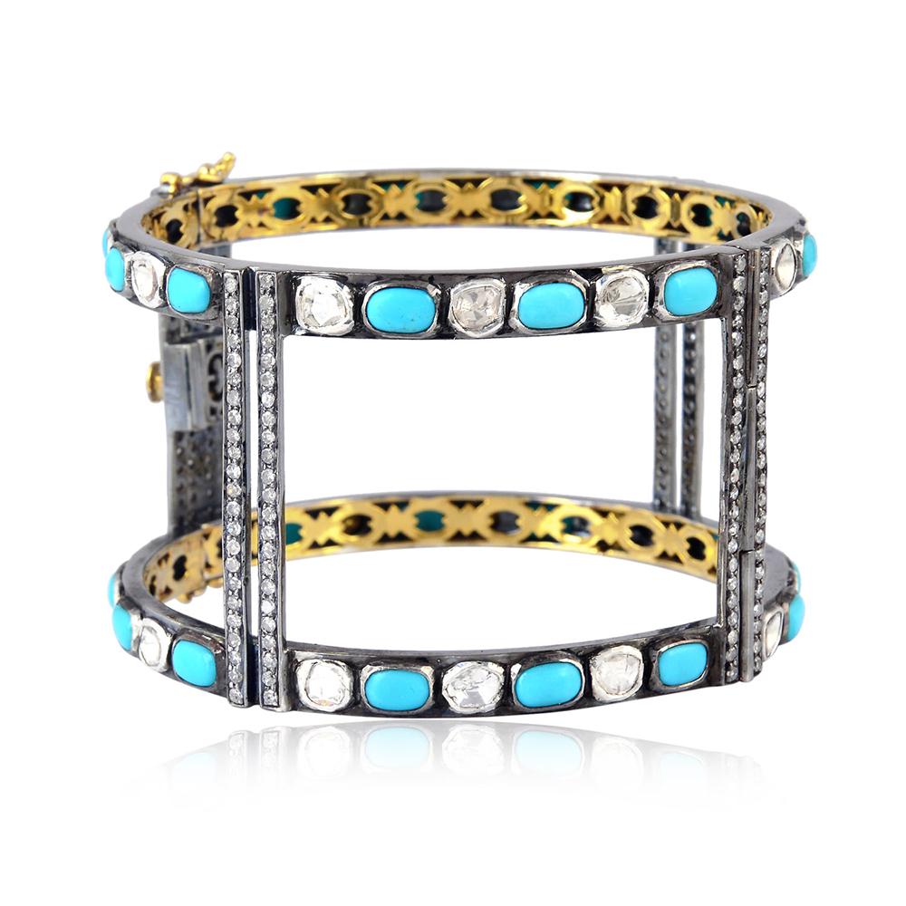 Open geometric style turquoise and diamond openable cuff bangle.

18k:3.25g
Diamond: 7.93ct
Sl:39.434g
TURQUOISE:12.9ct