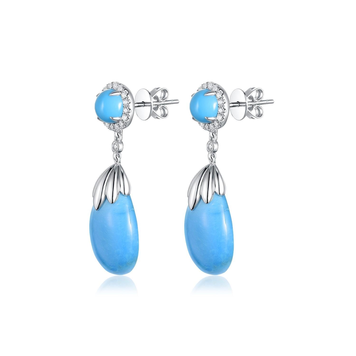These captivating earrings exude an air of sophistication and artistic flair, beautifully crafted from 14K white gold. Each earring features a serene turquoise gemstone, weighing a total of 3.98 grams, cut into a smooth teardrop shape that evokes