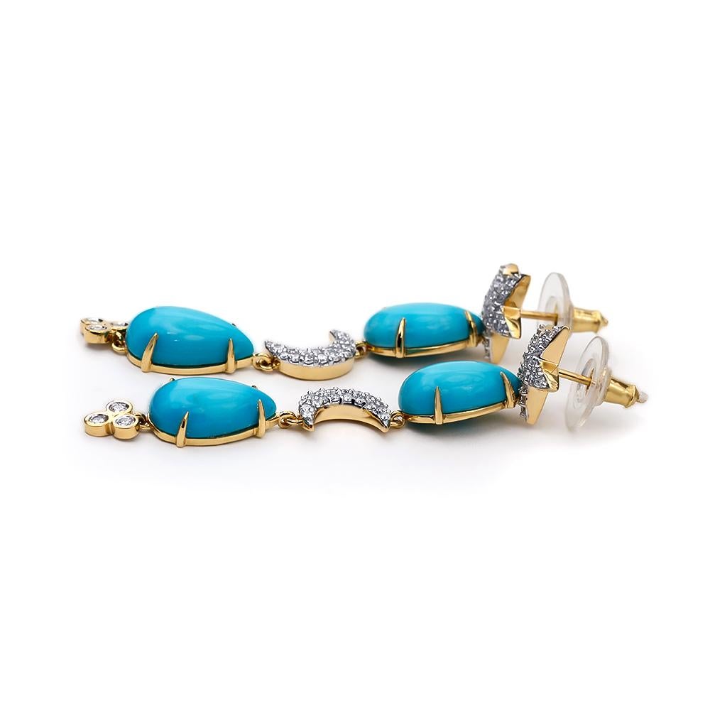 These earrings are crafted in 18kt yellow gold and features two pairs of pear shaped natural turquoise from the Sleeping Beauty Mine in Arizona weighing a total of 13.44 ct. The turquoise is complemented by a pavé set star and moon motif. The total