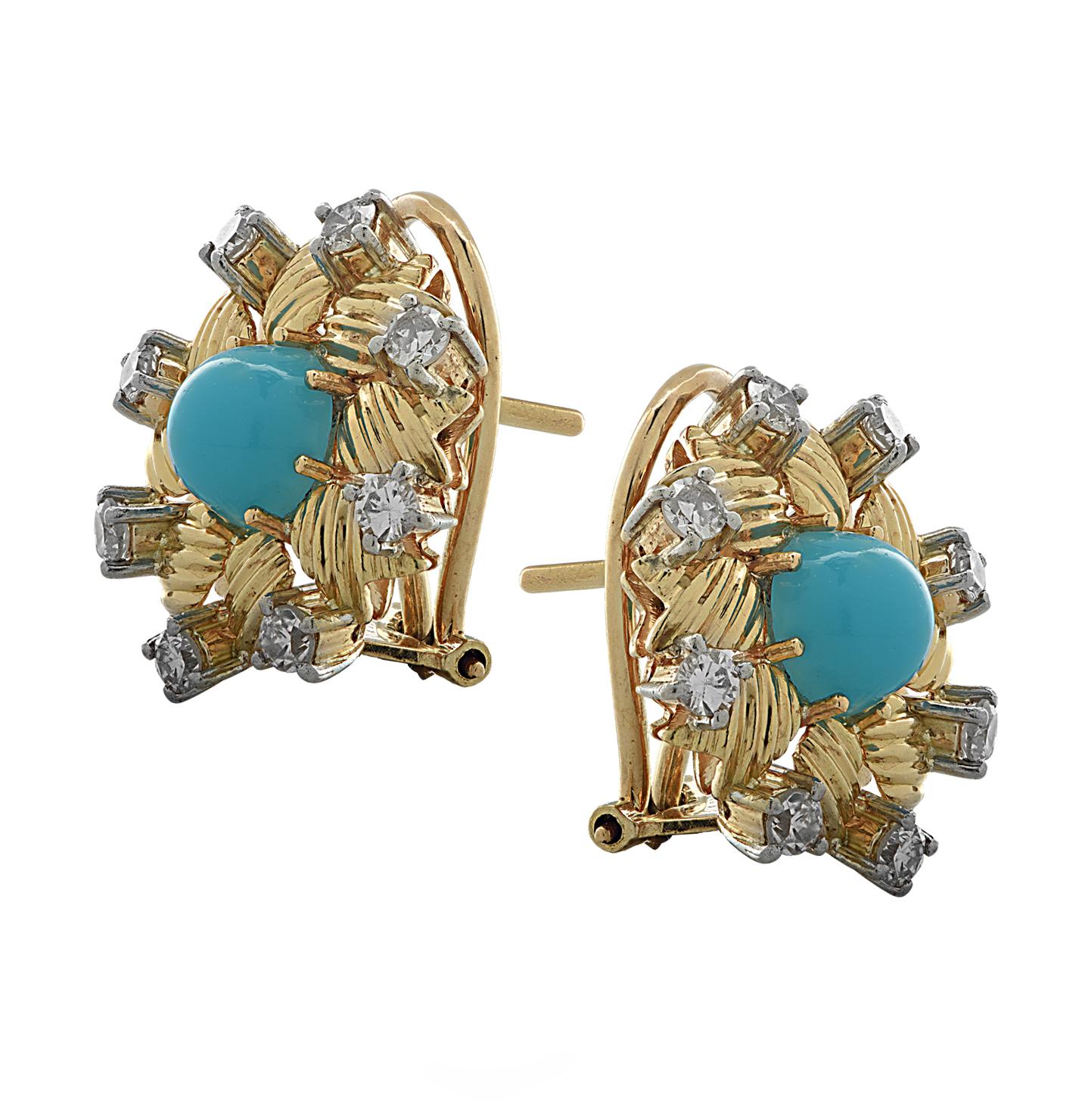 Beautiful stud earrings crafted in 18 karat yellow gold and platinum, fashioned into flowers, with textured yellow gold petals and blue turquoise cabochon centers, adorned with 16 transitional cut diamonds weighing approximately .50 carats total, G