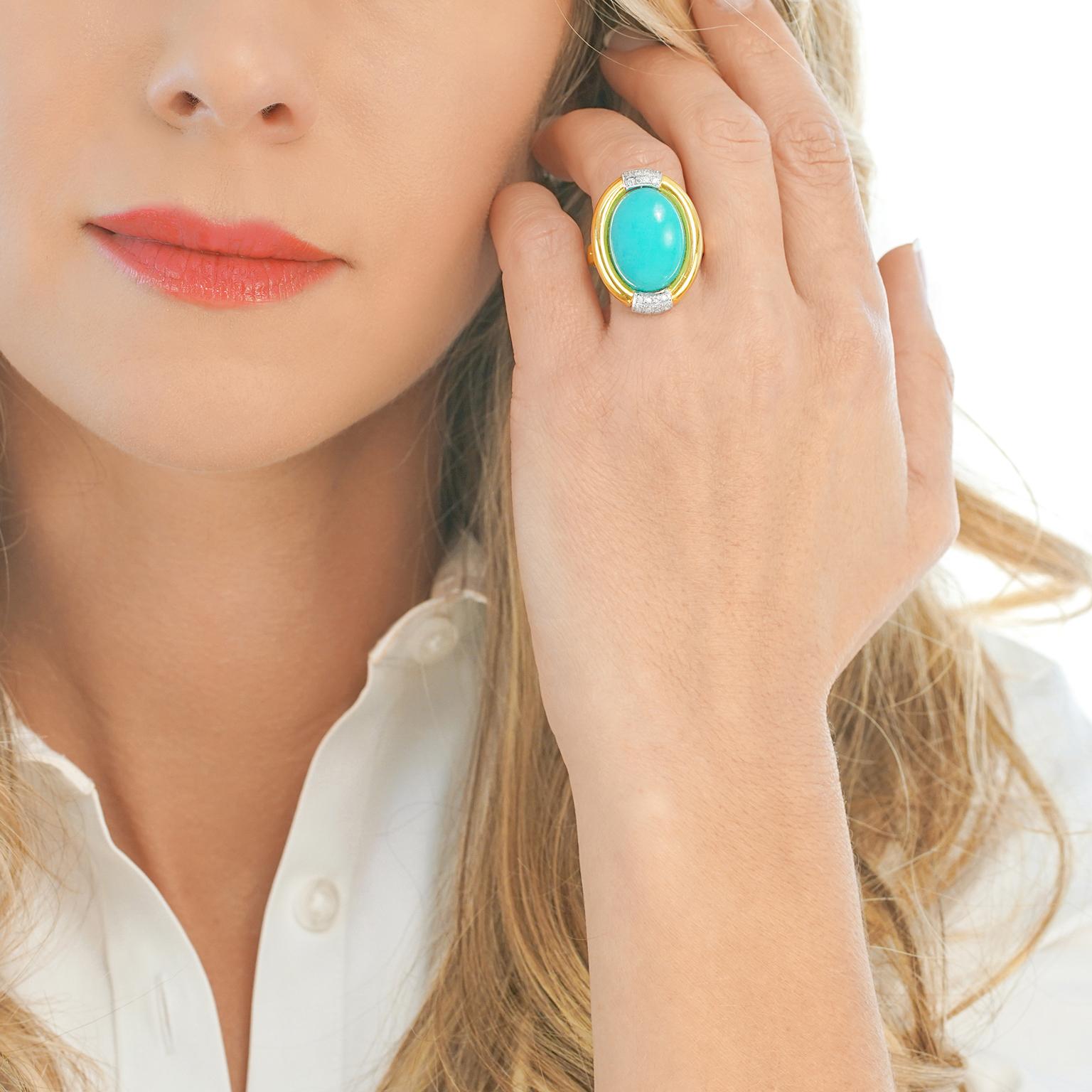 Circa 1960s, 14k, American. This elegant ring is set with a gorgeous sky blue Persian turquoise cabochon in a tailored gold frame trimmed with a sparkle of diamonds. The look is the stylishly put-together side of the sixties. Finely made, it is in