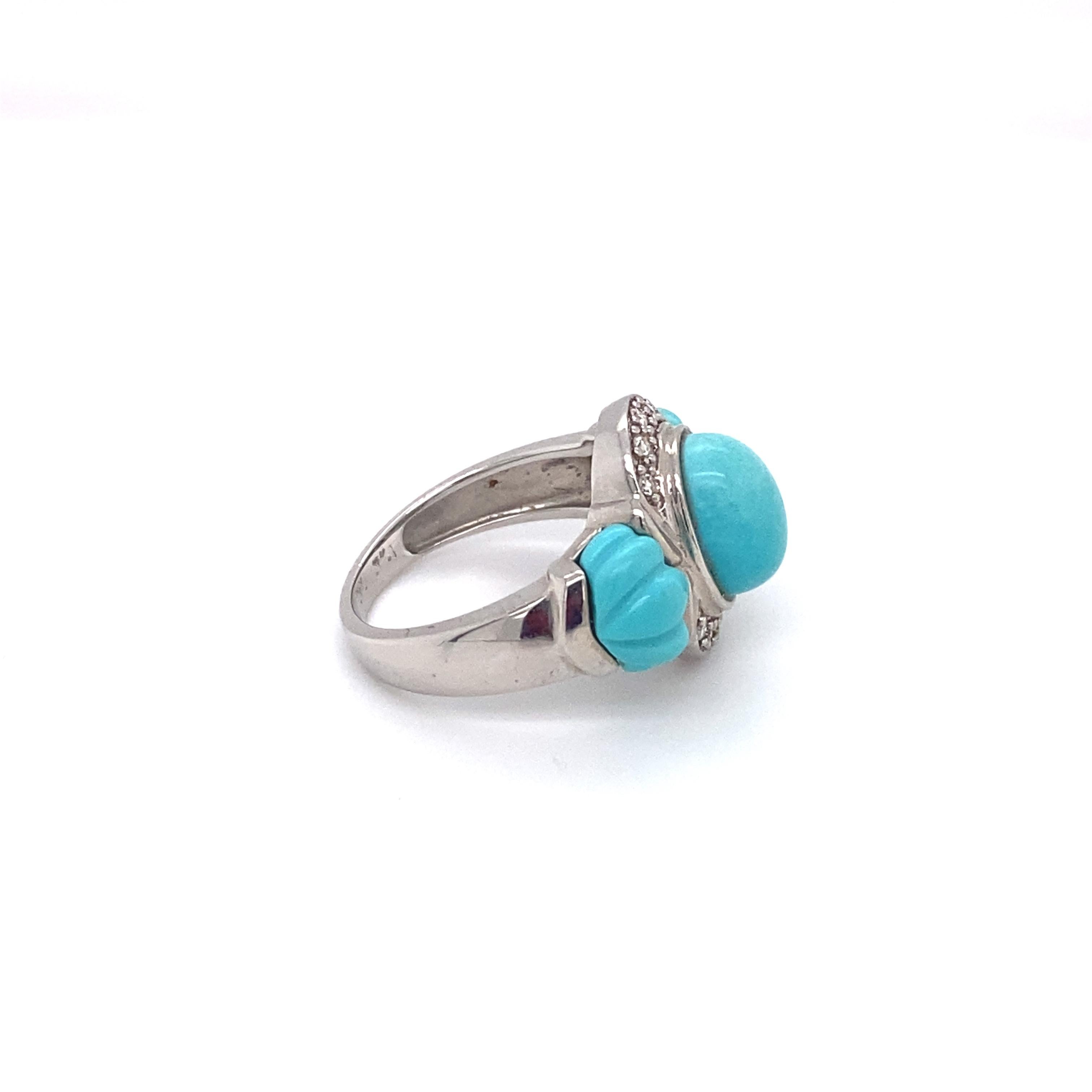 Circa: 1980
Metal Type: 14K white gold 
Weight: 5.4 grams
Size: US 4.5

Featuring 3 Turquoise gemstones and accent diamonds
Symmetrical and beautifully crafted design
Hallmarked 14K
