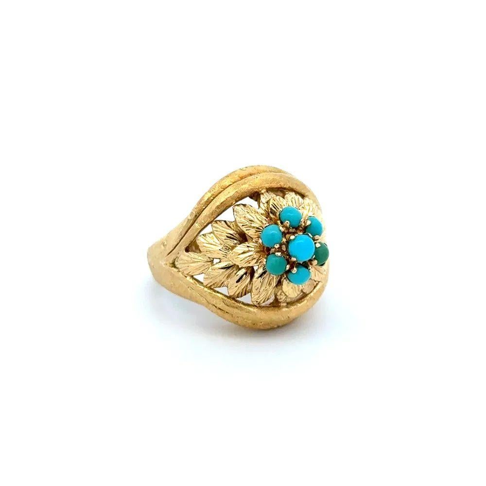 Finely detailed Turquoise Gold Vintage 1960s Cluster Ring. Centering Hand set Turquoise. Surrounded by Gold leave designs. Ring measures approx. 1.1” l x 0.80” w x 0.70” h. Hand crafted in 18K Yellow Gold. Ring size 5, we offer ring resizing. The