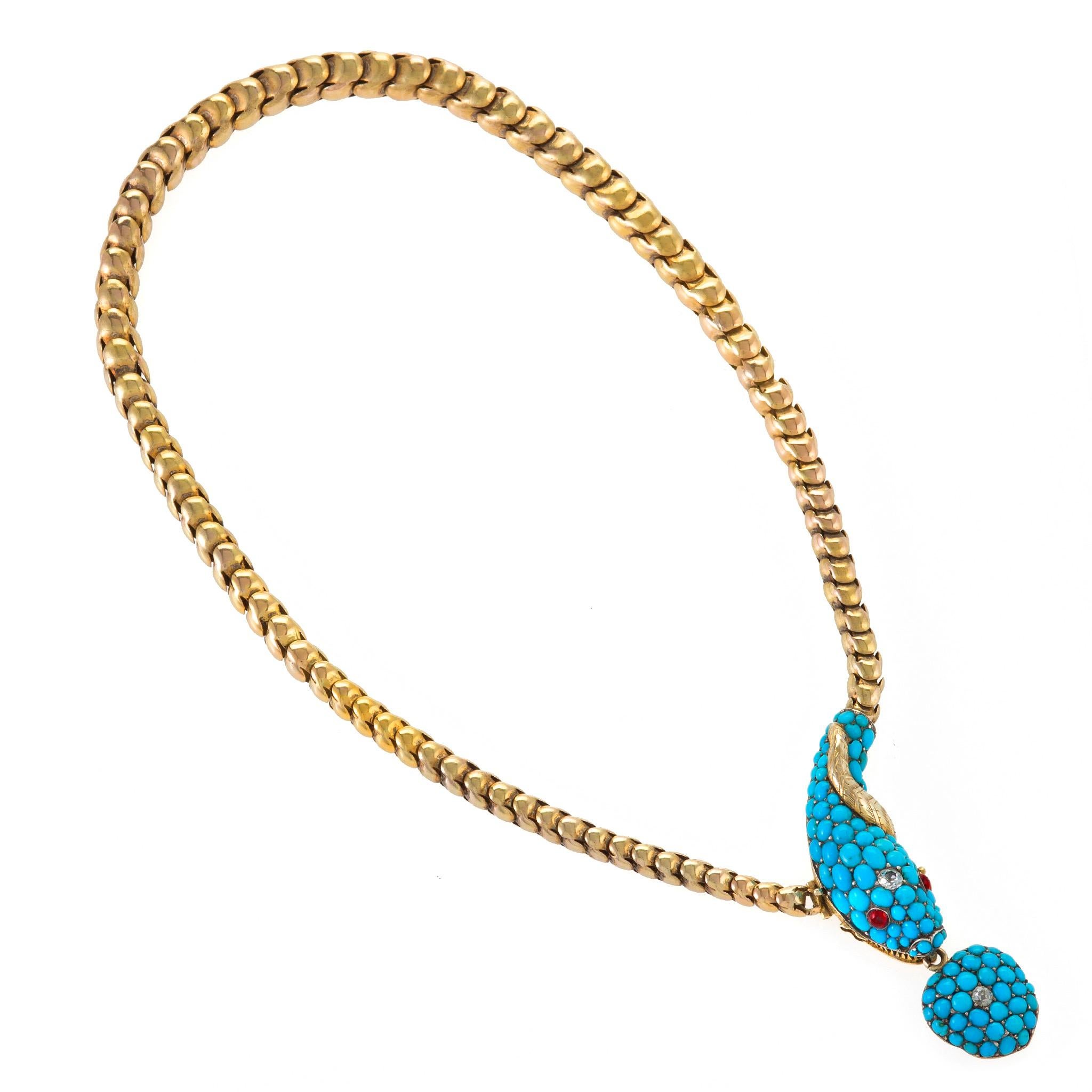 Dating from the 1840s, this gold serpent necklace with heart-shaped locket is set with turquoise, diamonds, and rubies. The tapering flexible necklace of gold S-form links resembling a snake’s patterned body is designed as a serpent with pave-set