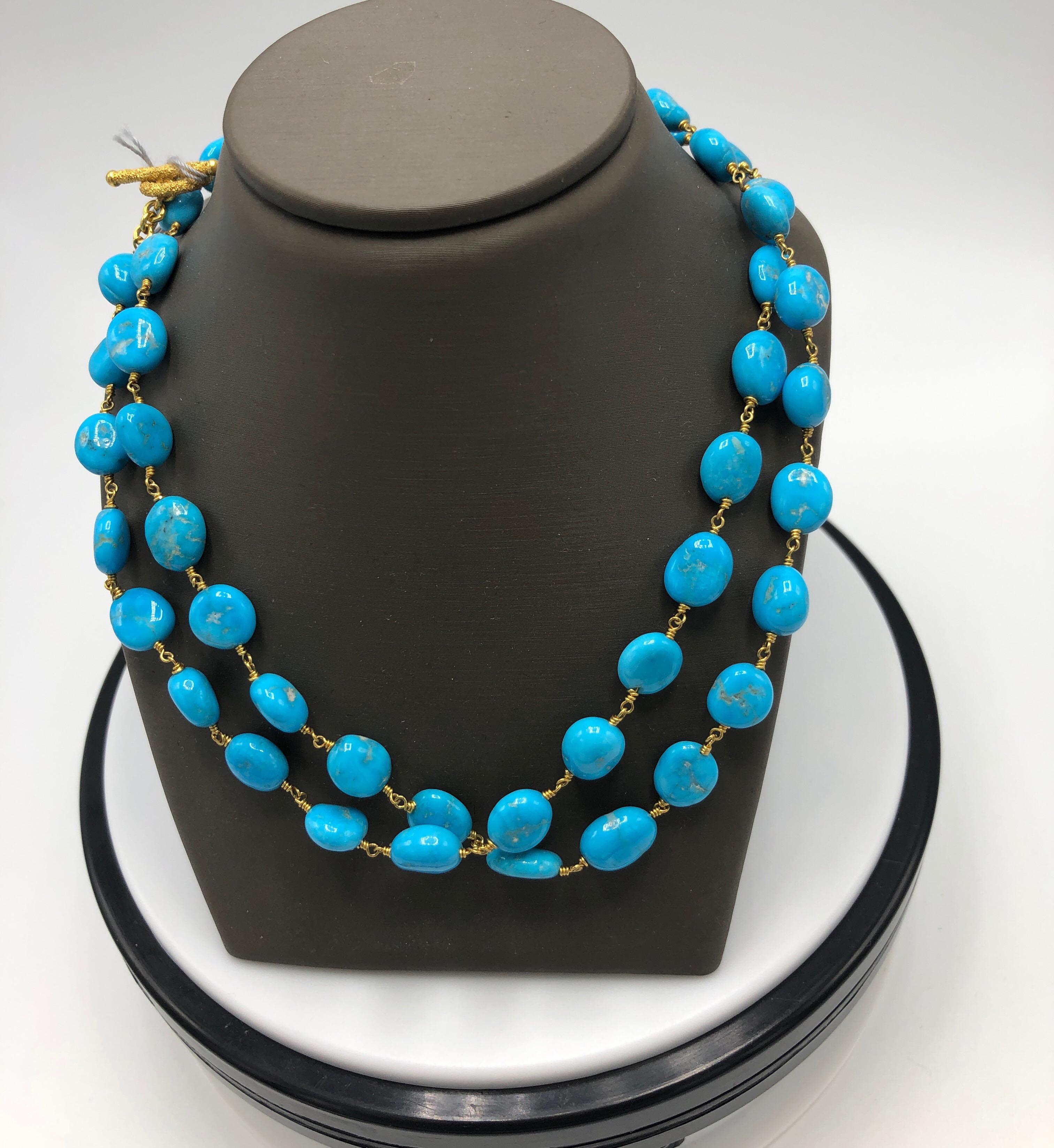 Turquoise and Gold Wire Wrap Necklace from Kimarie Designs.  Toggle Clasp, this necklace is 26 inches in length.  
18k Gold and Turquoise.  