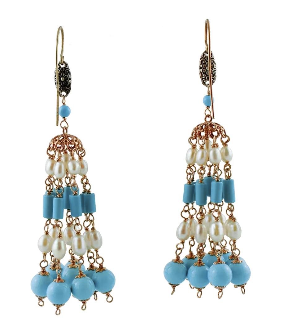 Vintage beaded dangle earrings in 9k rose gold and silver structure, with turquoise paste beads and baroque pearls.
The origin of these particular earrings dates back to the 1980s, they were totally handmade by Italian master goldsmiths and they are