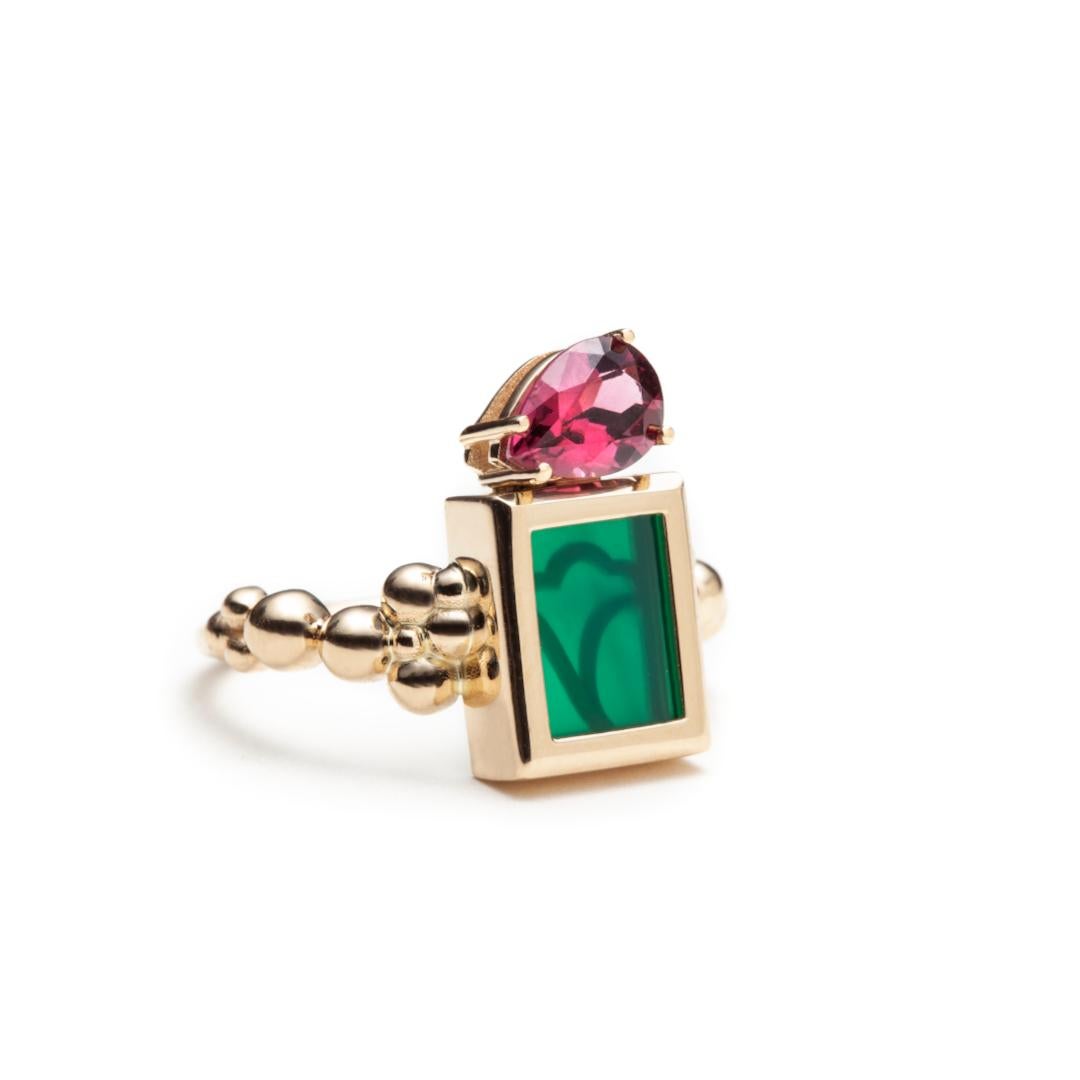 We make this colorful ring in 14k yellow gold set with a rectangular turquoise plate and a peridot teardrop. The top measurements, covering both stones are 16 mm x 9 mm x 4.5 mm. Our decorative logo holds the Turquoise in place from behind giving