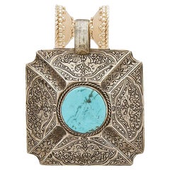 Turquoise and Sterling Silver Carved Pendant