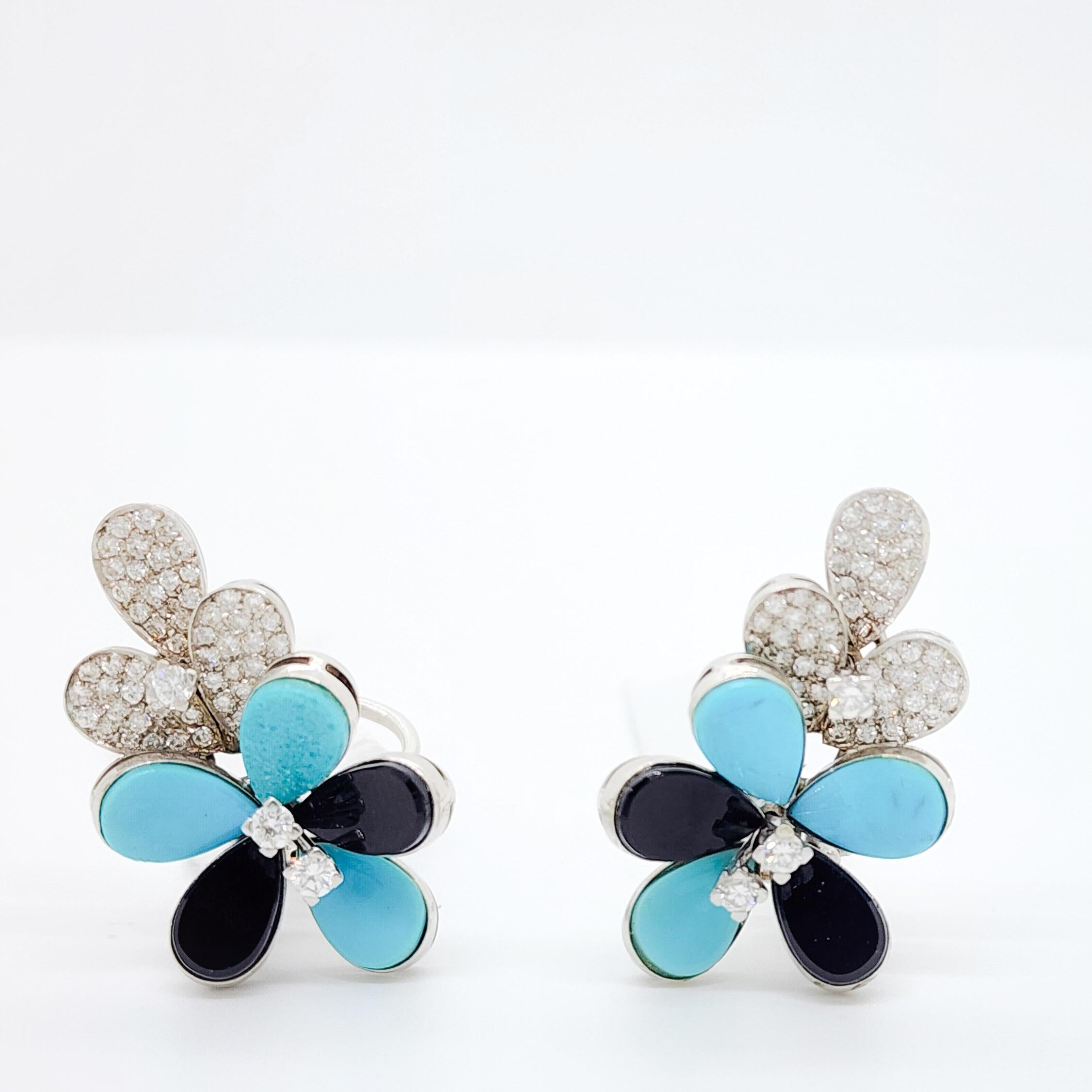 Gorgeous turquoise pear shapes and 1.50 ct. good quality white diamond round floral cluster earrings handmade in 18k white gold.  Has matching ring and necklace.  