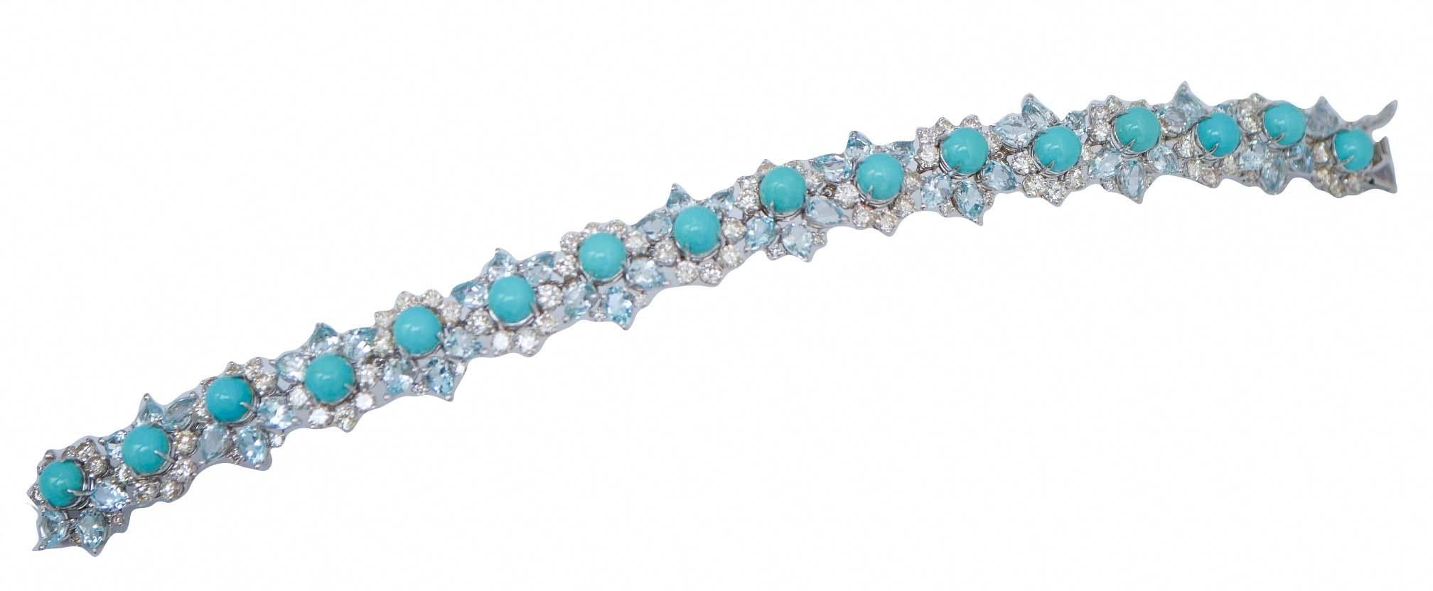 Amazing bracelet in 14 kt white gold structure mounted by  16 sections with a central turquoise surrounded by diamonds and topaz alternated.
This bracelet was totally handmade by Italian master goldsmiths and it is in perfect conditions.
Diamonds