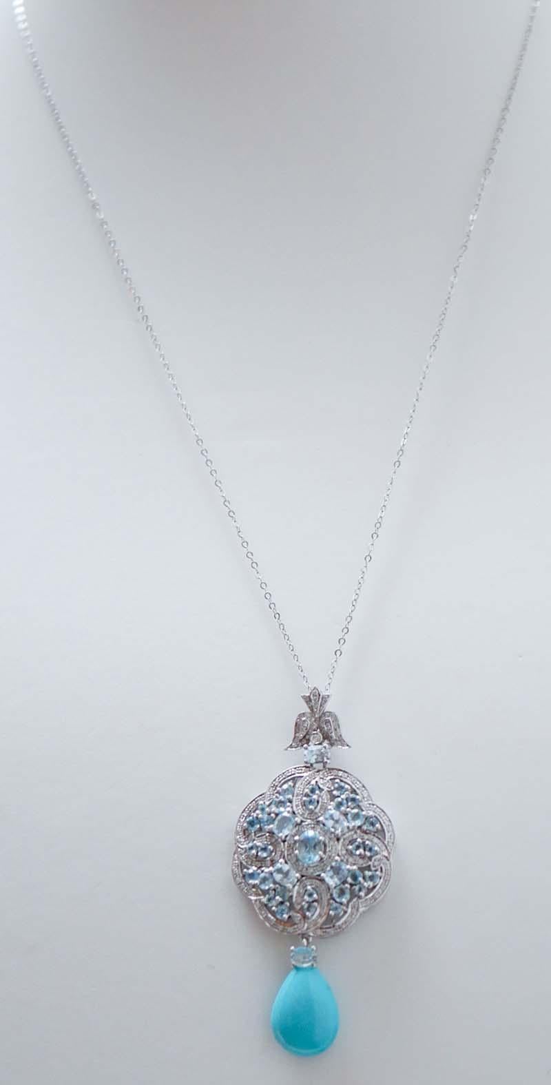 Amazing pendant necklace in 14 kt white gold structure mounted with diamonds an, between of them, topaz. As pendant, a drop turquoise.
The chain in 9 kt white gold is included.
Diamonds 0.43 ct
Topaz 3.58 ct
Turquoise 1.00 gr
Total Weight 9.30 gr
RF