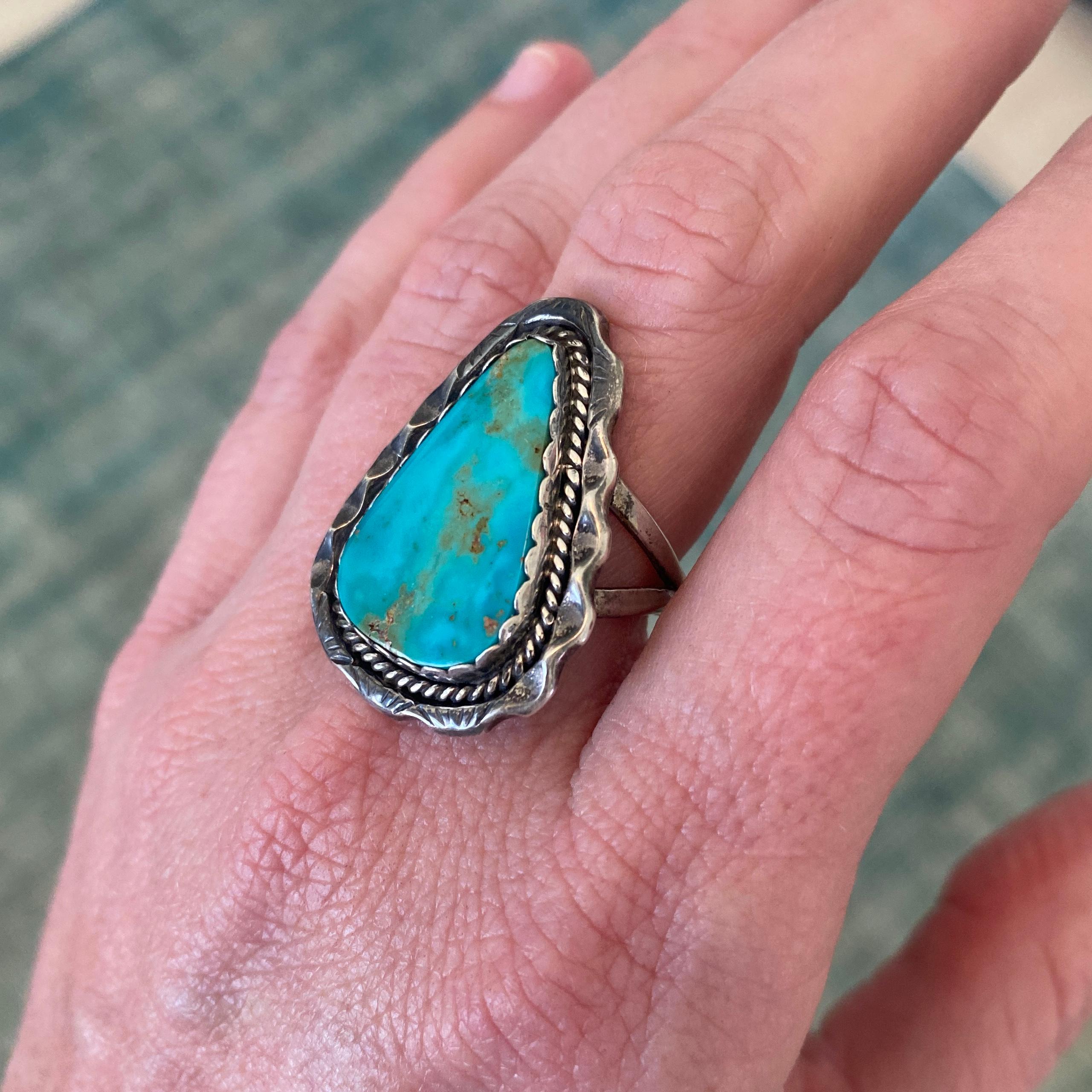 Vintage, Turquoise Arrowhead Shaped Smooth Cabochon Textured Large Statement Sterling Ring Handmade, Native American, Navajo
Size 7 1/2 
Free shipping anywhere in the US.