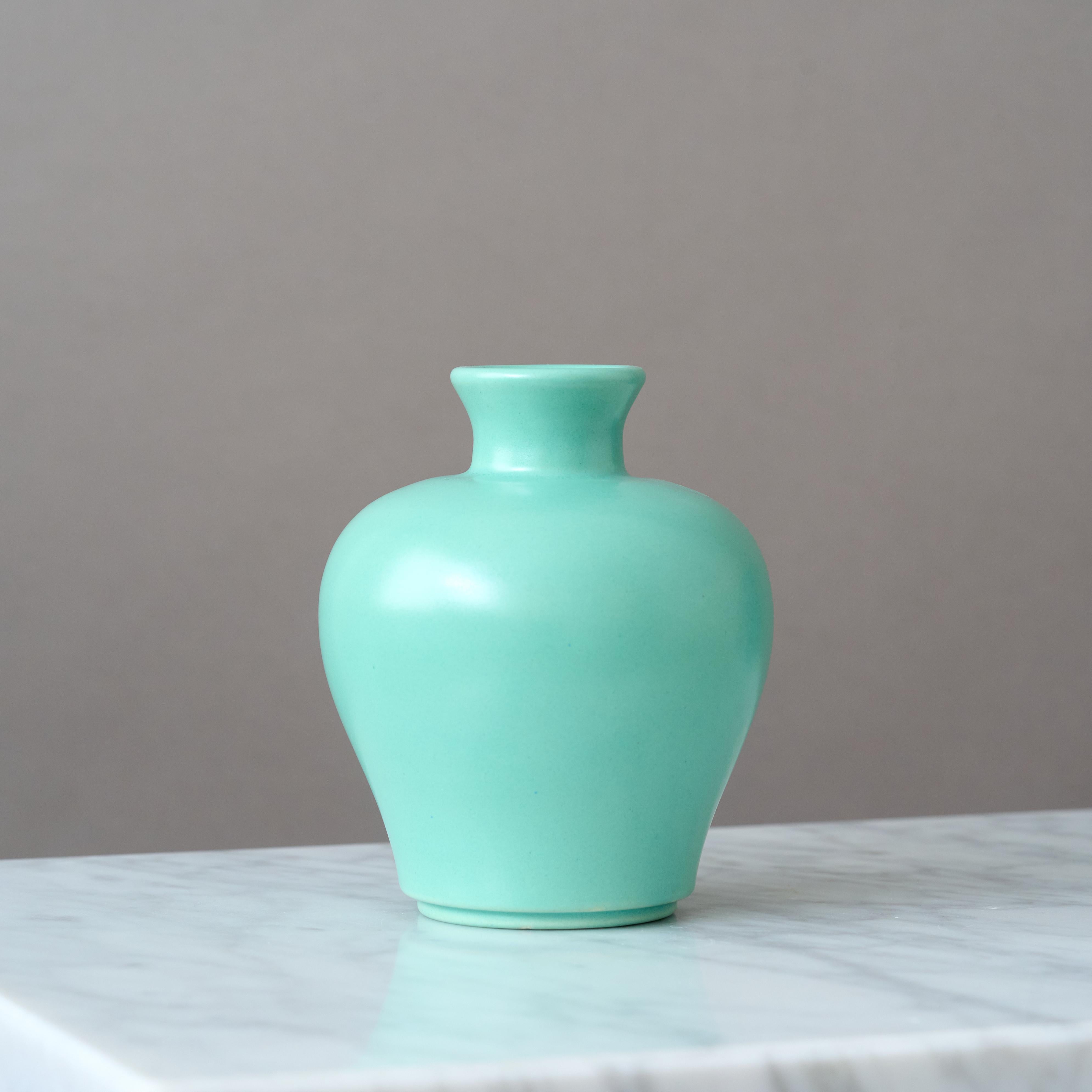 A beautiful Art Deco vase with amazing green / turquoise glaze. 
Designed by Ewald Dahlskog for Bo Fajans (Bobergs Fajansfabrik), Sweden, 1930s.

Great condition. 
Makers marks impressed on base of vase. 

Ewald Dahlskog (1894-1950) was a pioneering