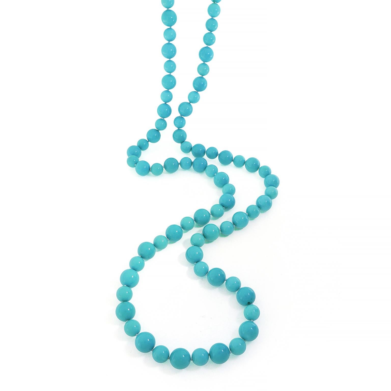 The prized beauty of turquoise embodies this necklace. Larger and smaller spheres of the Caribbean blue hued gem alternate in a pattern, while showcasing subtle variations in color. The total weight of the turquoise is 729.02 carats. An 18k yellow
